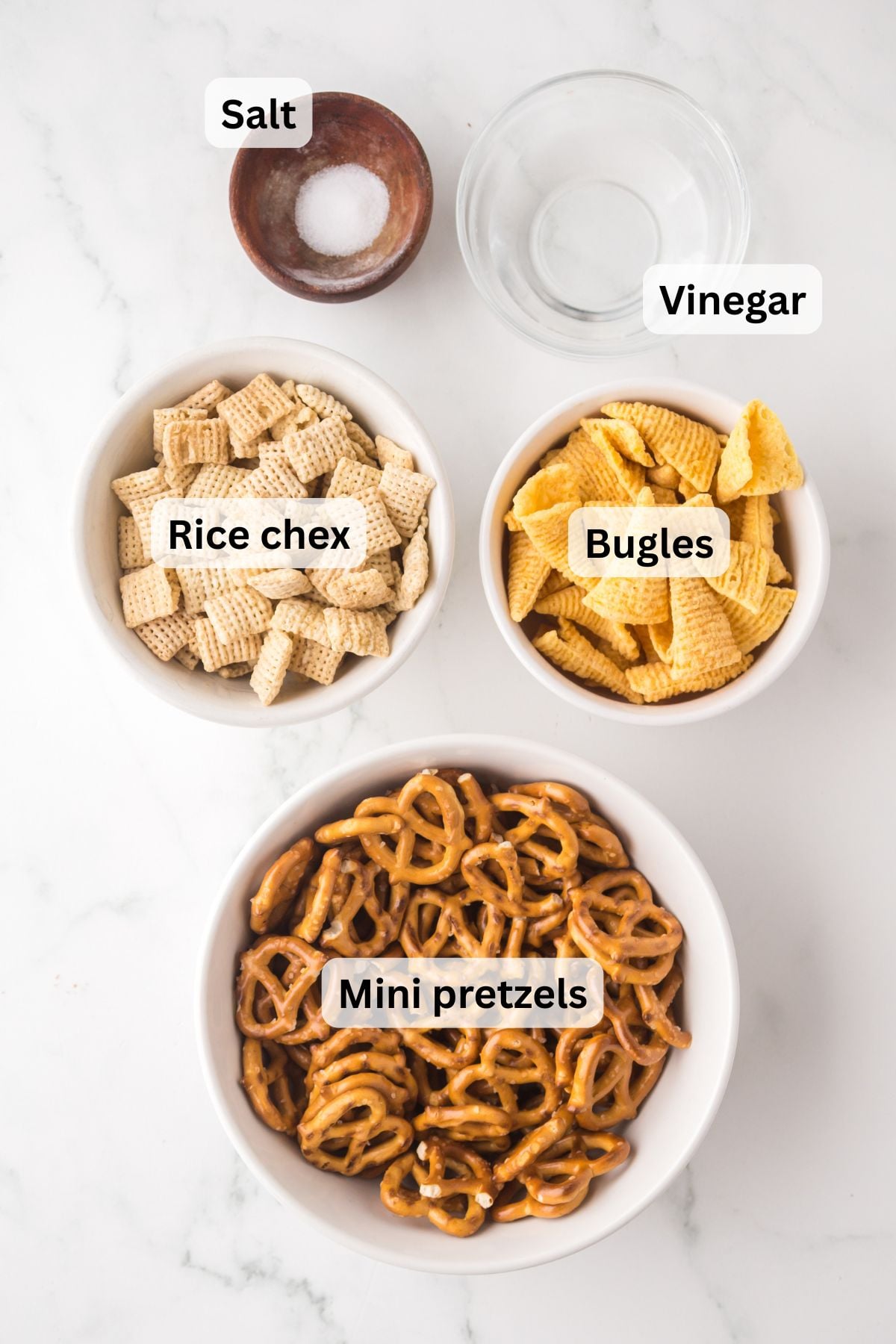 all of the ingredients needed to make salt and vinegar mix in bowls on a table