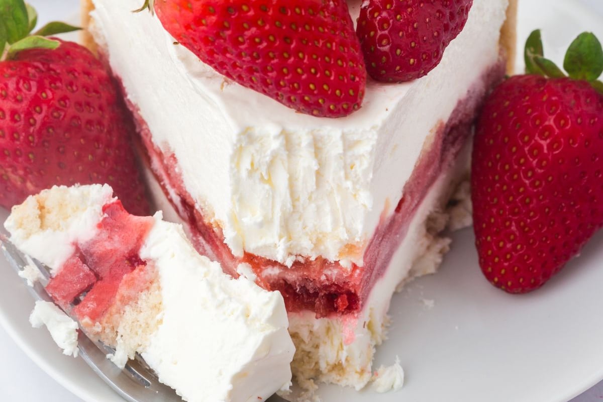 A slice on a plate with a forkful.