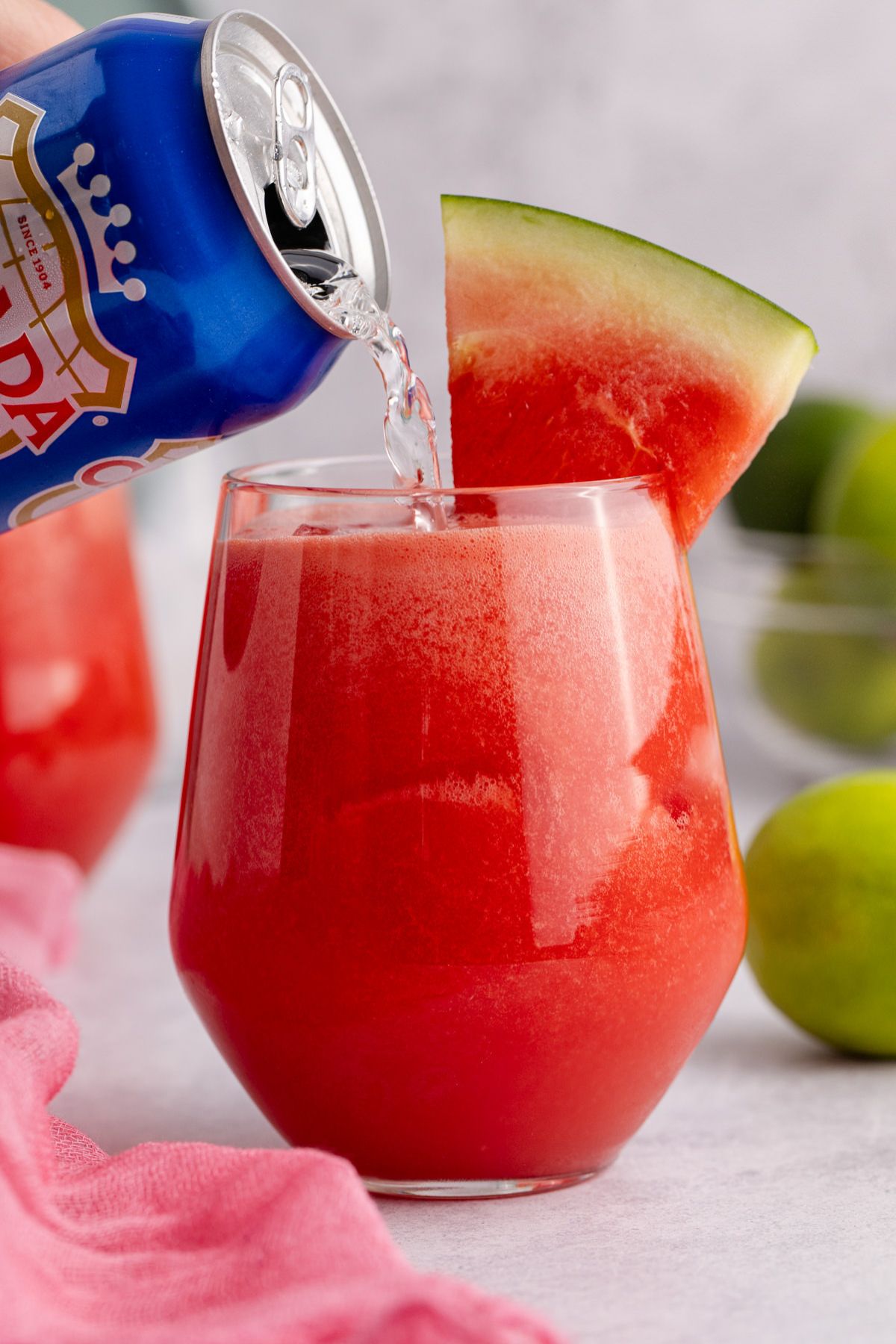 Soda being added to drink.