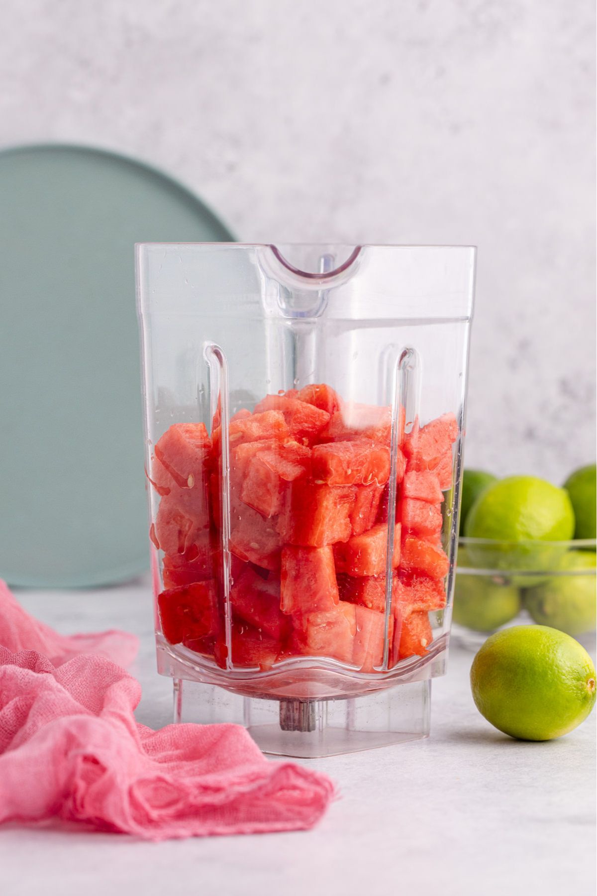Chunks of watermelon in a blender.