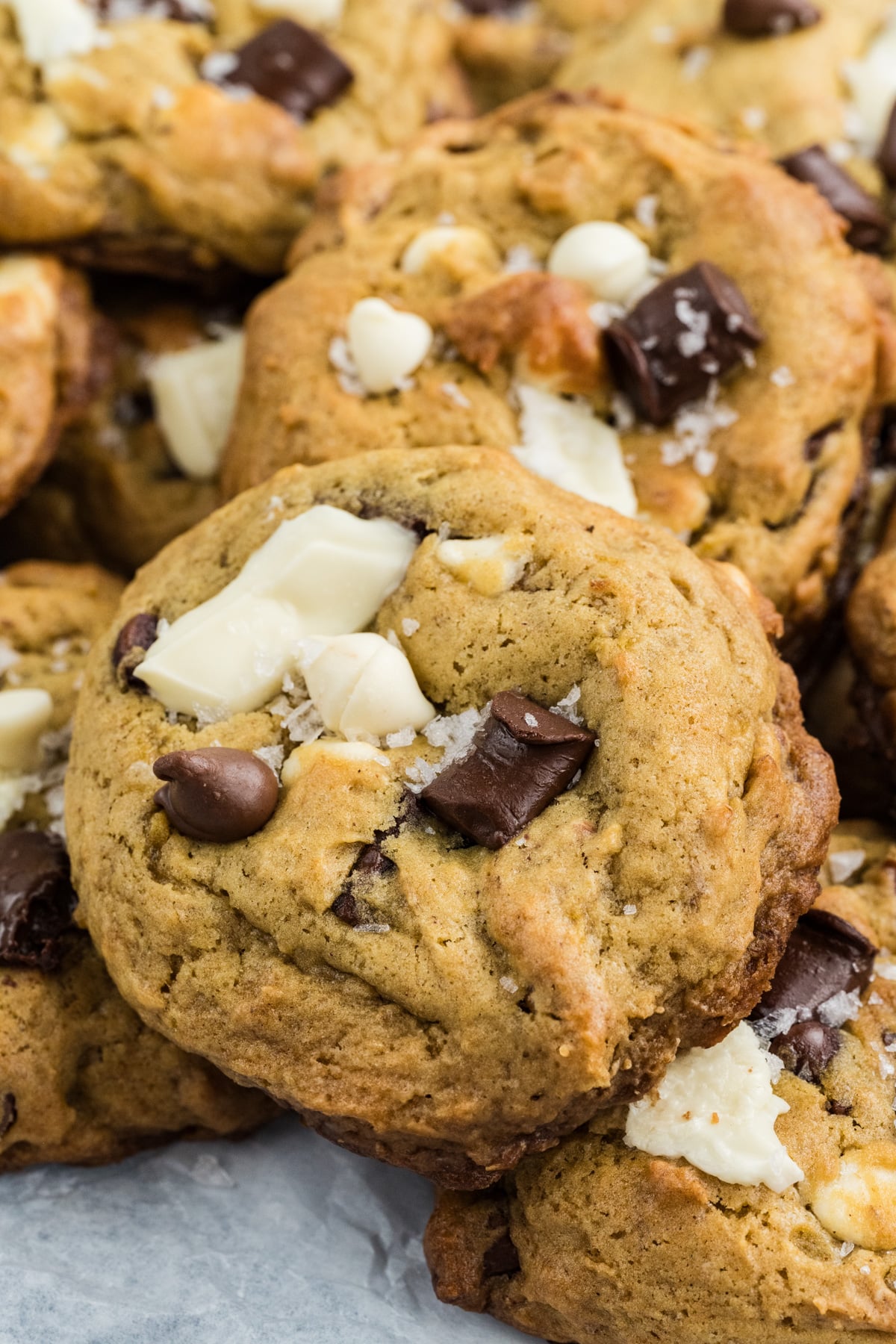 A stack of banana bread cookies on parchment paper.