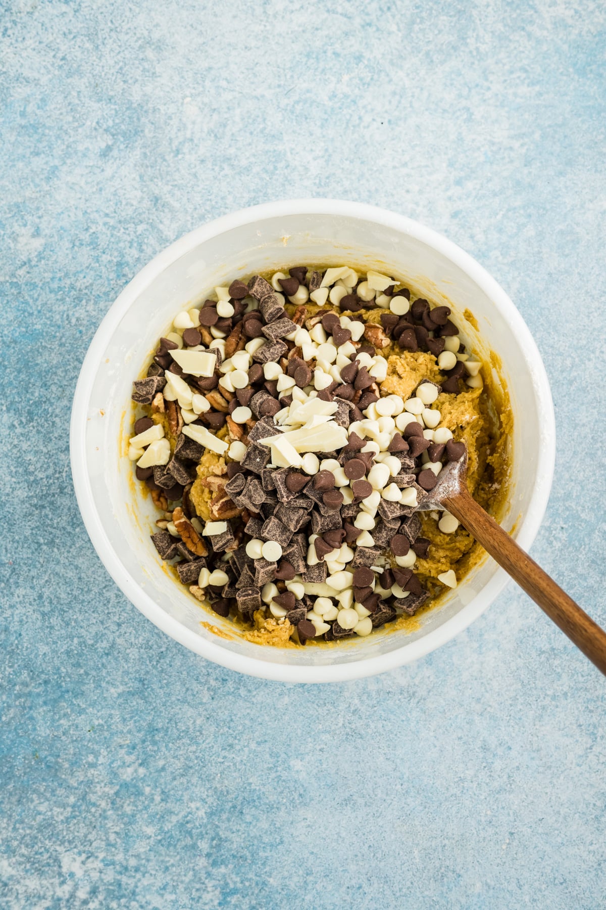 Chocolate chips, chunks, and chopped nuts added into the mixture.