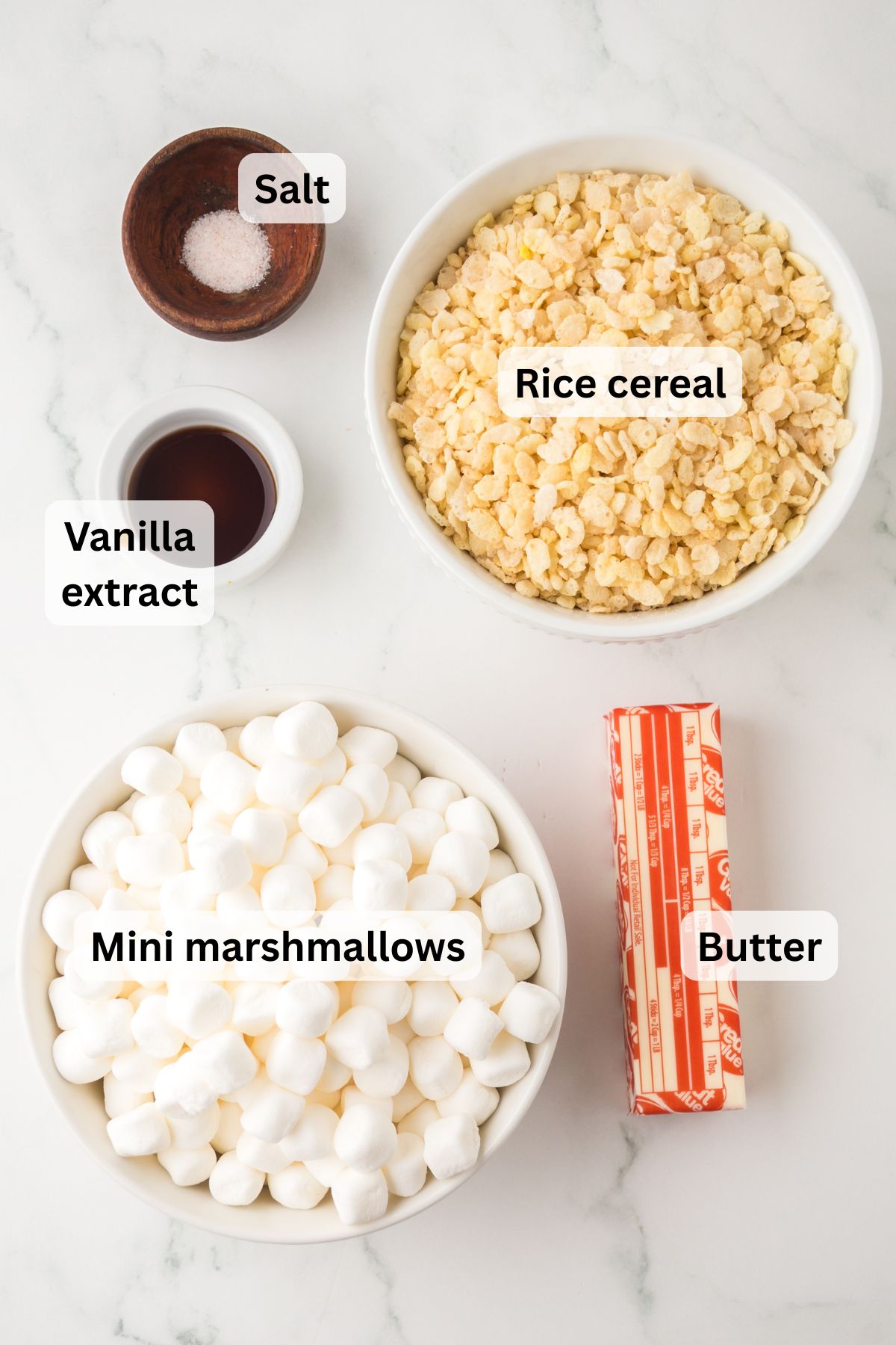 All of the ingredients needed to make browned butter Rice Krispie treats in bowls on a table