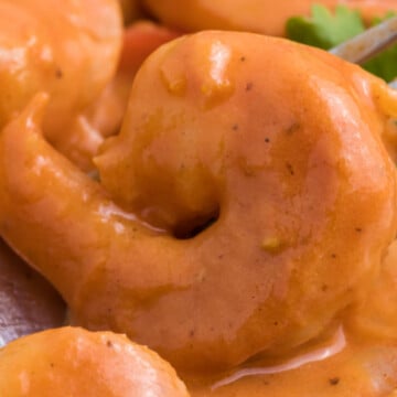 A bowl full of curried shrimp.