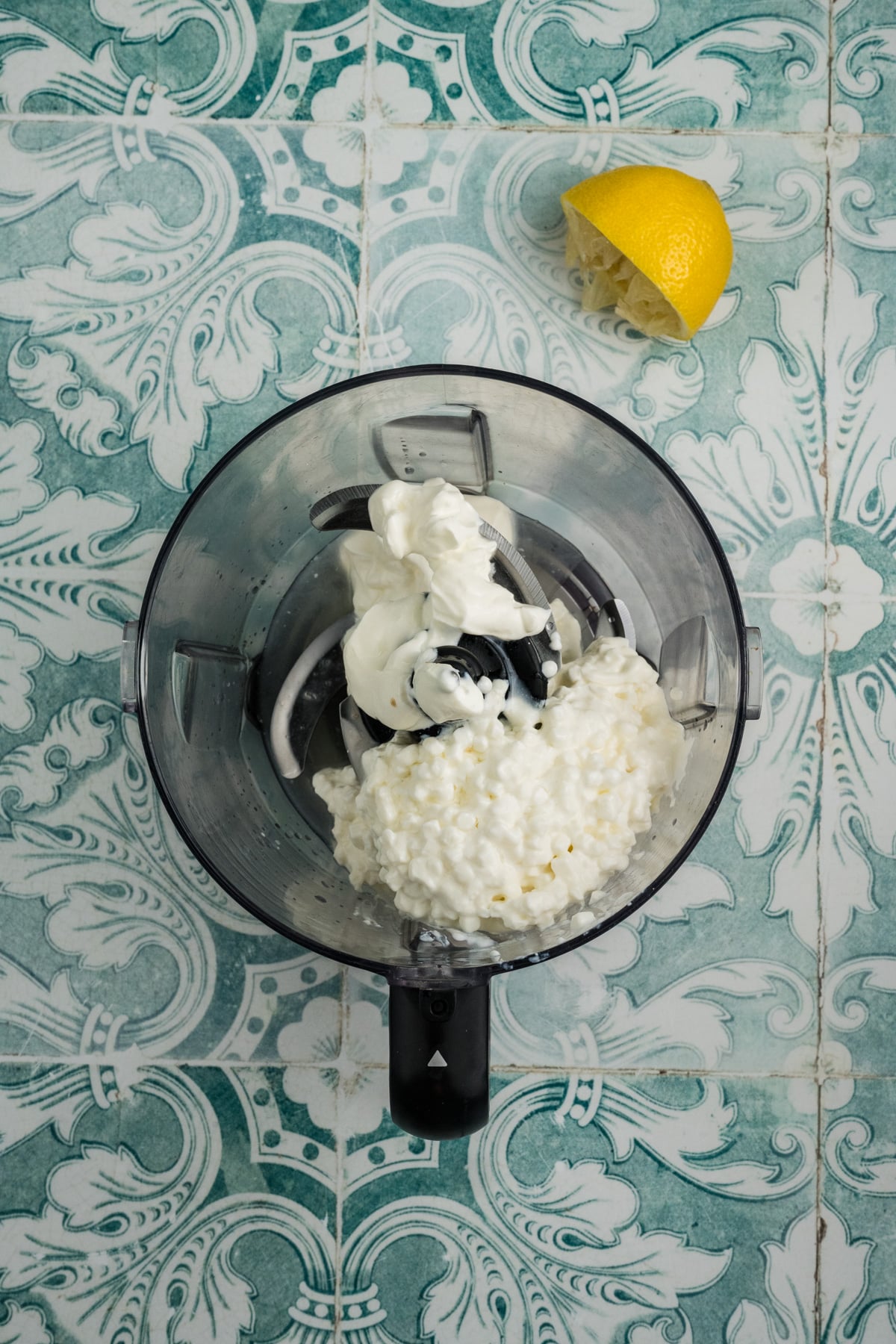 All of the ingredients added to a food processor.