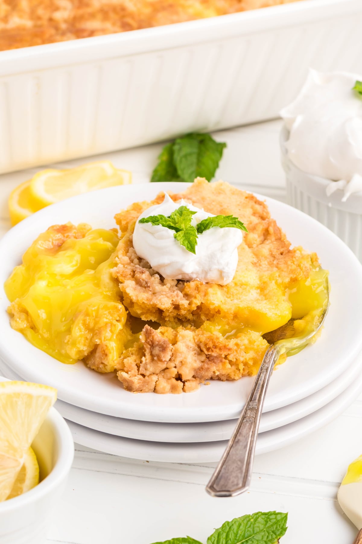 A spoon on the side of lemon dump cake.