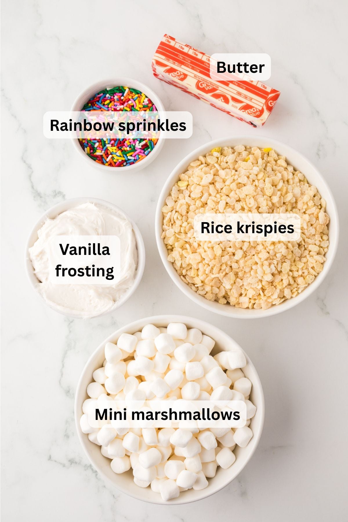 Ingredients needed to make Rice Krispie Treat Cake in bowls on counter