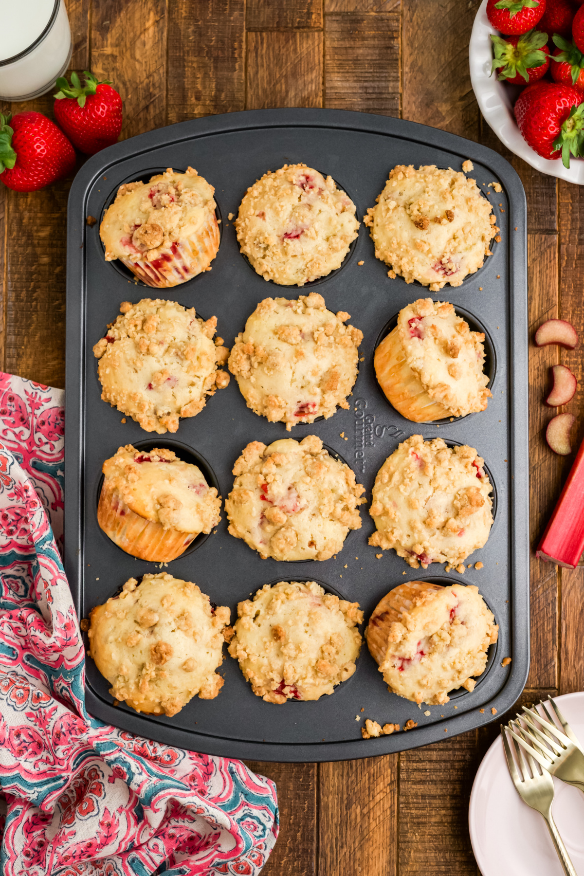 Strawberry rhubarb muffins cooling in the muffin tin.