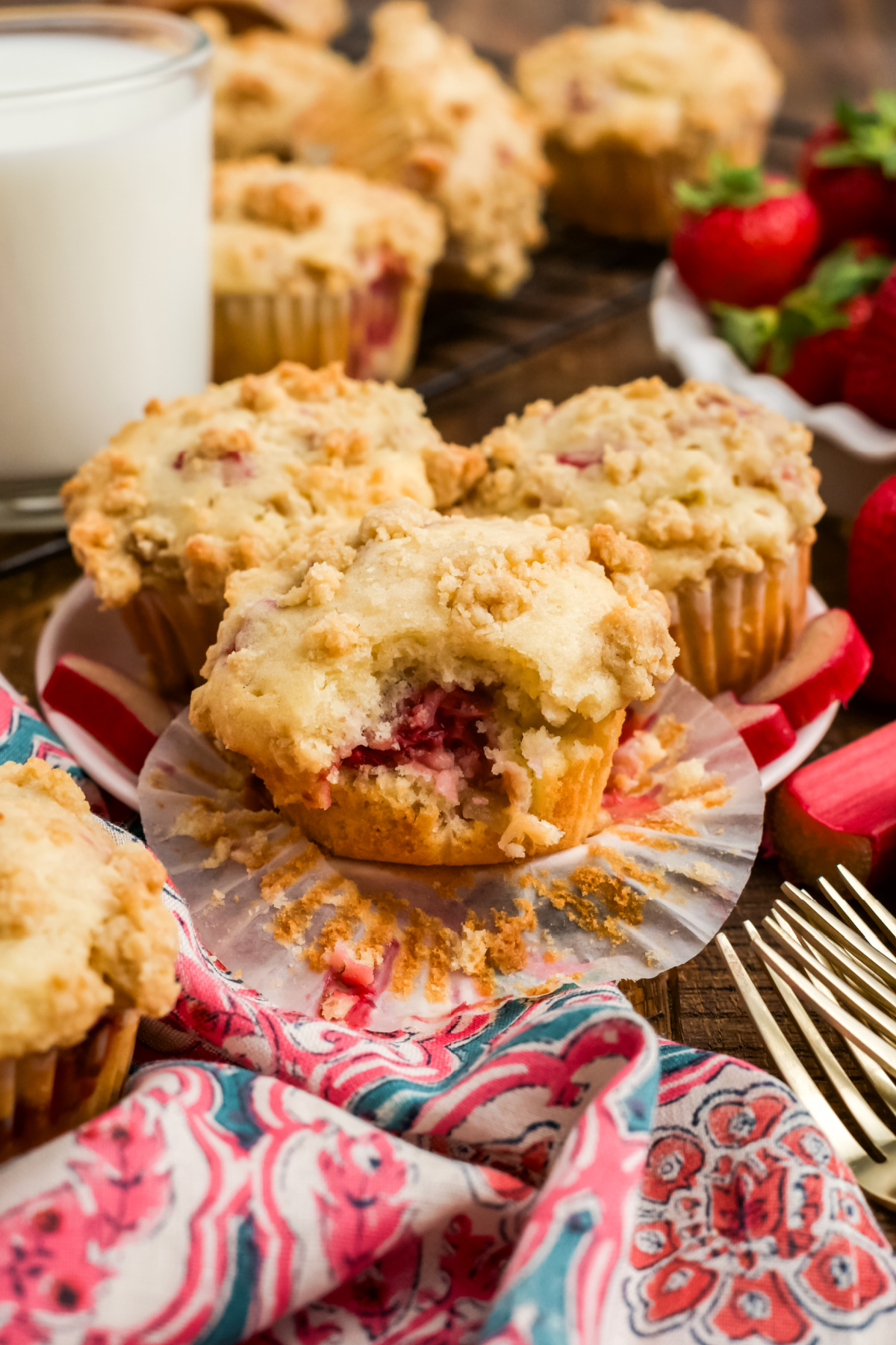 A plate full of muffins with strawberry rhubarb.