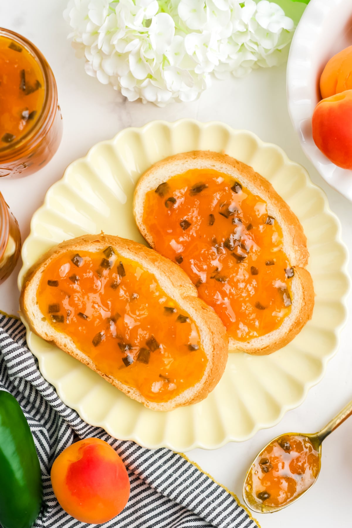 Two slices of bread with apricot jam.