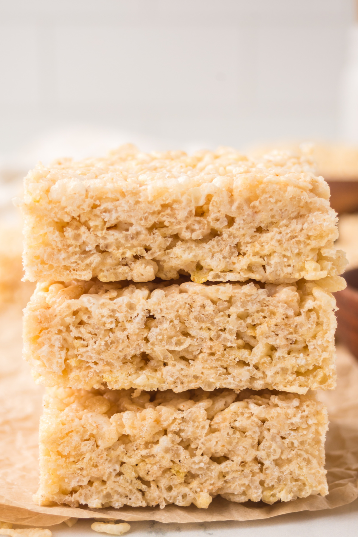 A stack of three Rice Krispie treats on a table