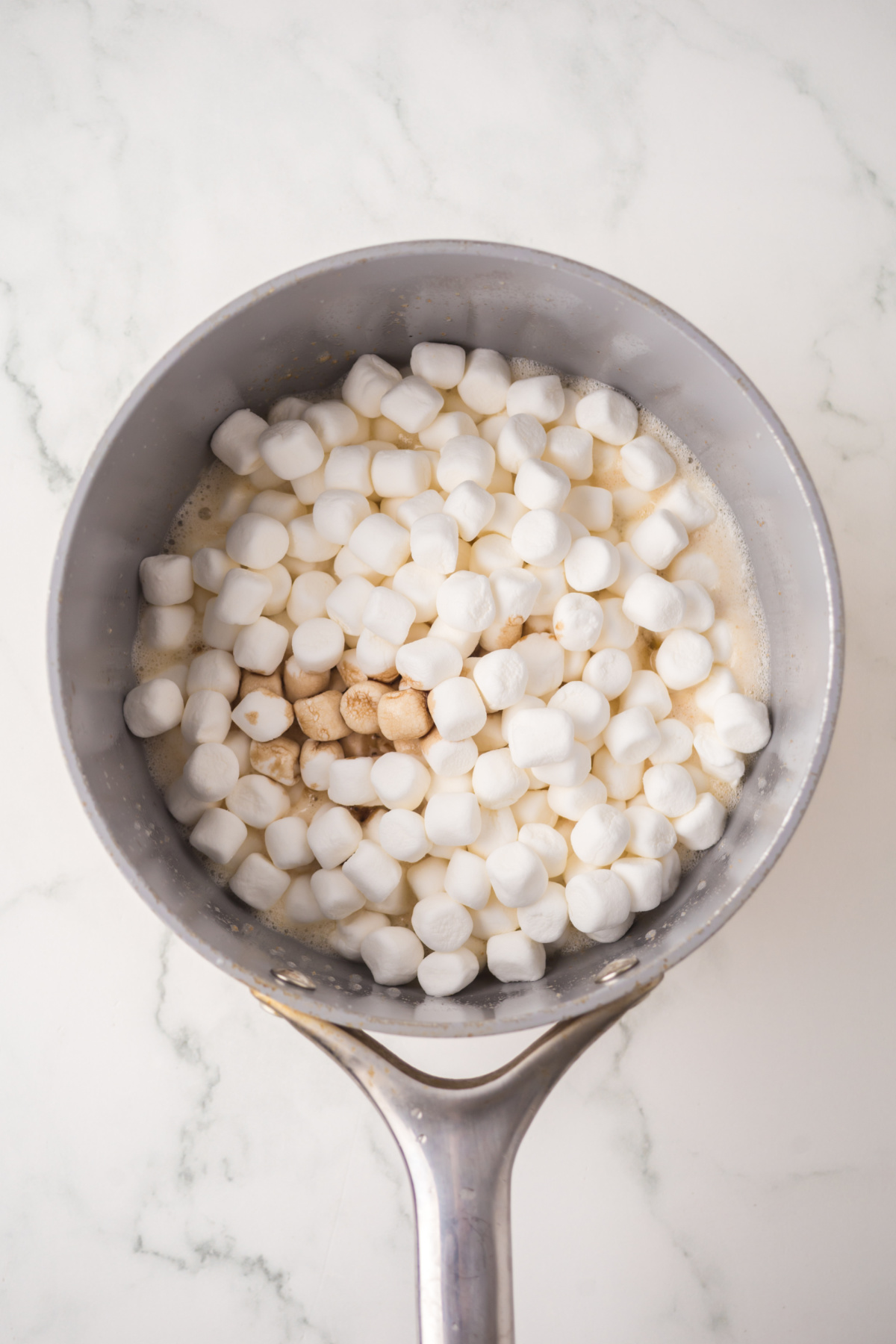 vanilla, salt and marshmallows added to brown butter filled saucepan