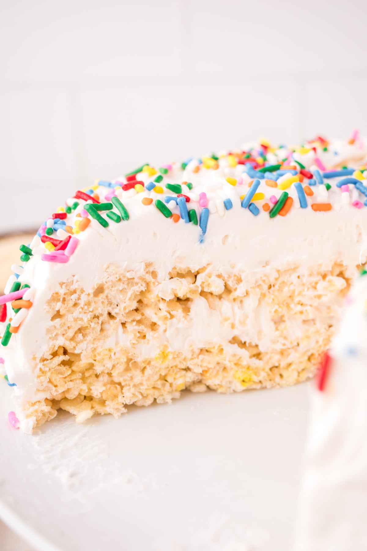 rice krispie treat cake recipe missing a few slices on a platter