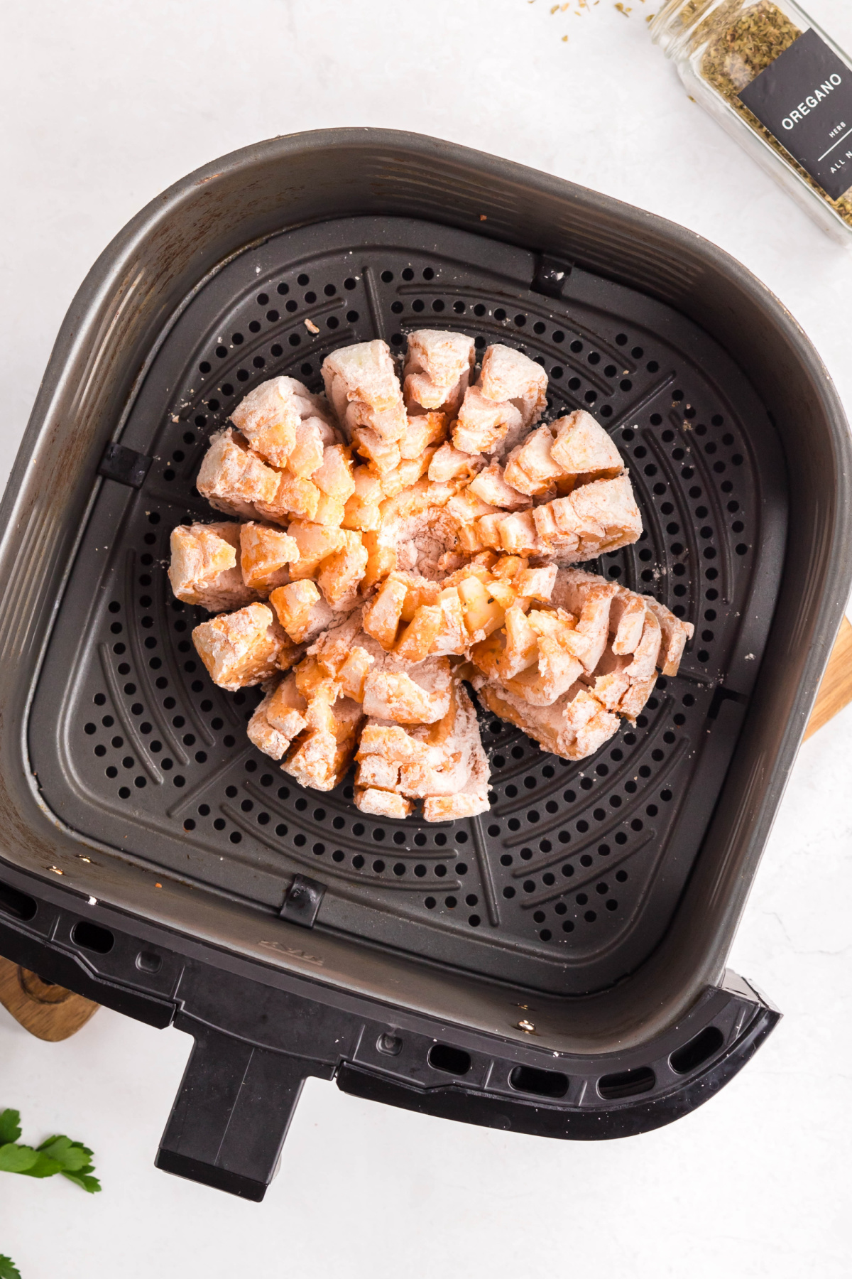 The onion placed in the air fryer.