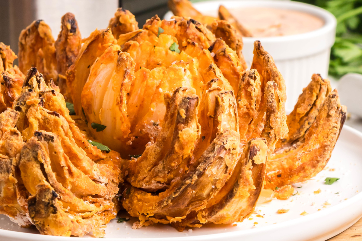 Air fryer blooming onion on a plate.