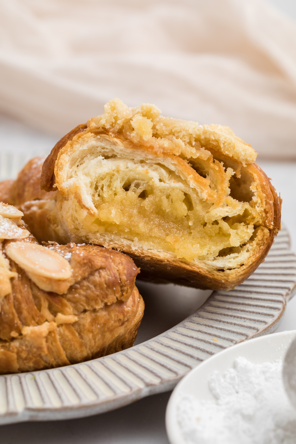 A croissant in half showing the filling.