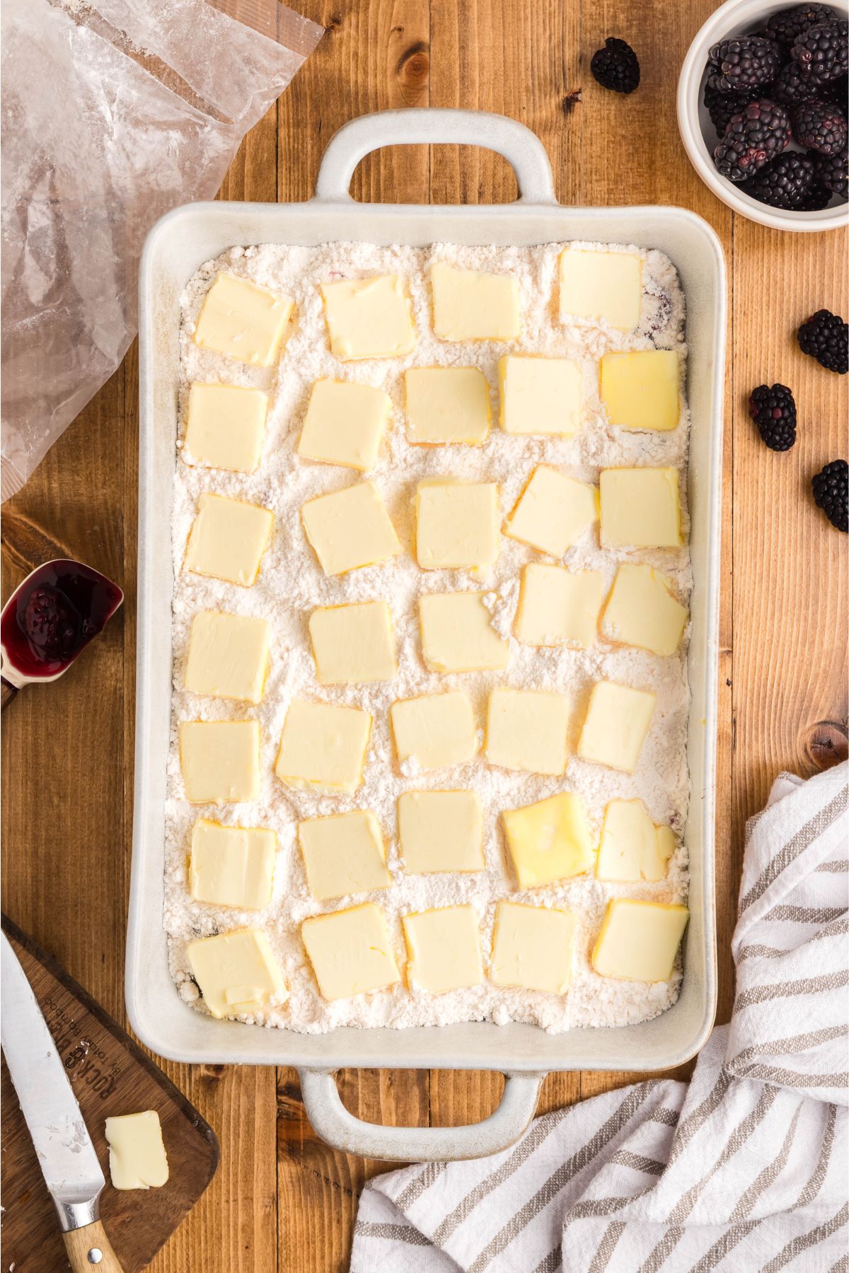 Butter slices over top of the cake mix.