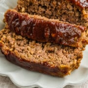 Old fashioned meatloaf sliced on a platter.