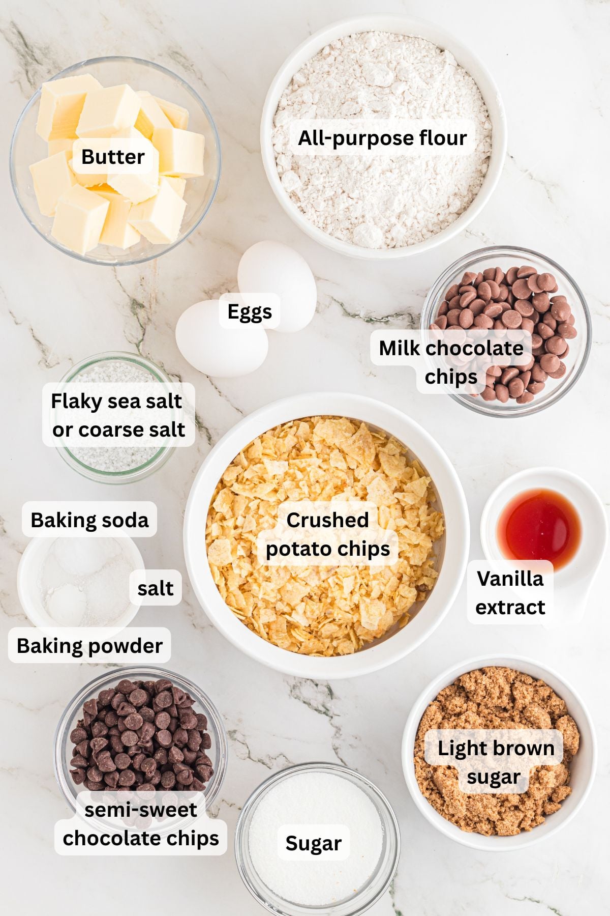 Ingredients to make these cookies with potato chips in bowls on a table.