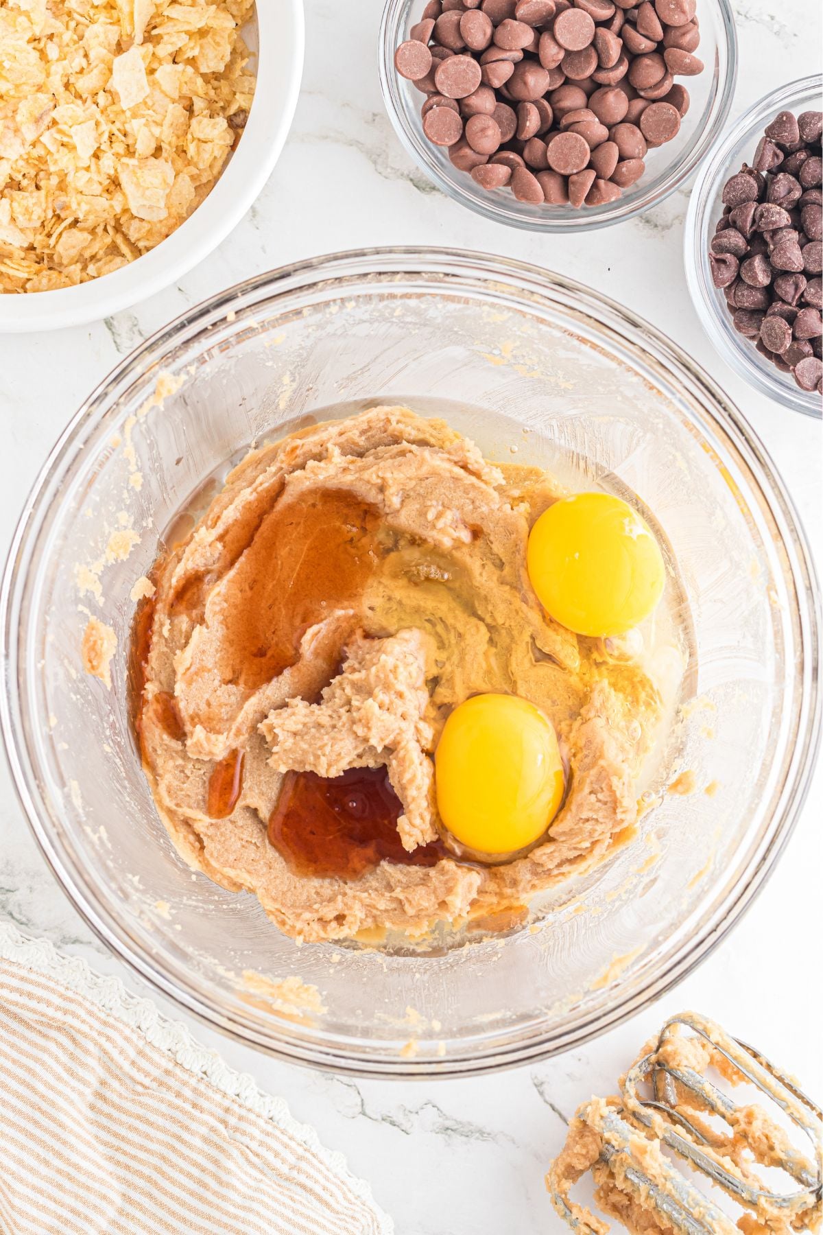 Eggs added to the bowl and beaten.