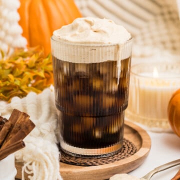 Pumpkin cold foam in coffee on a table.