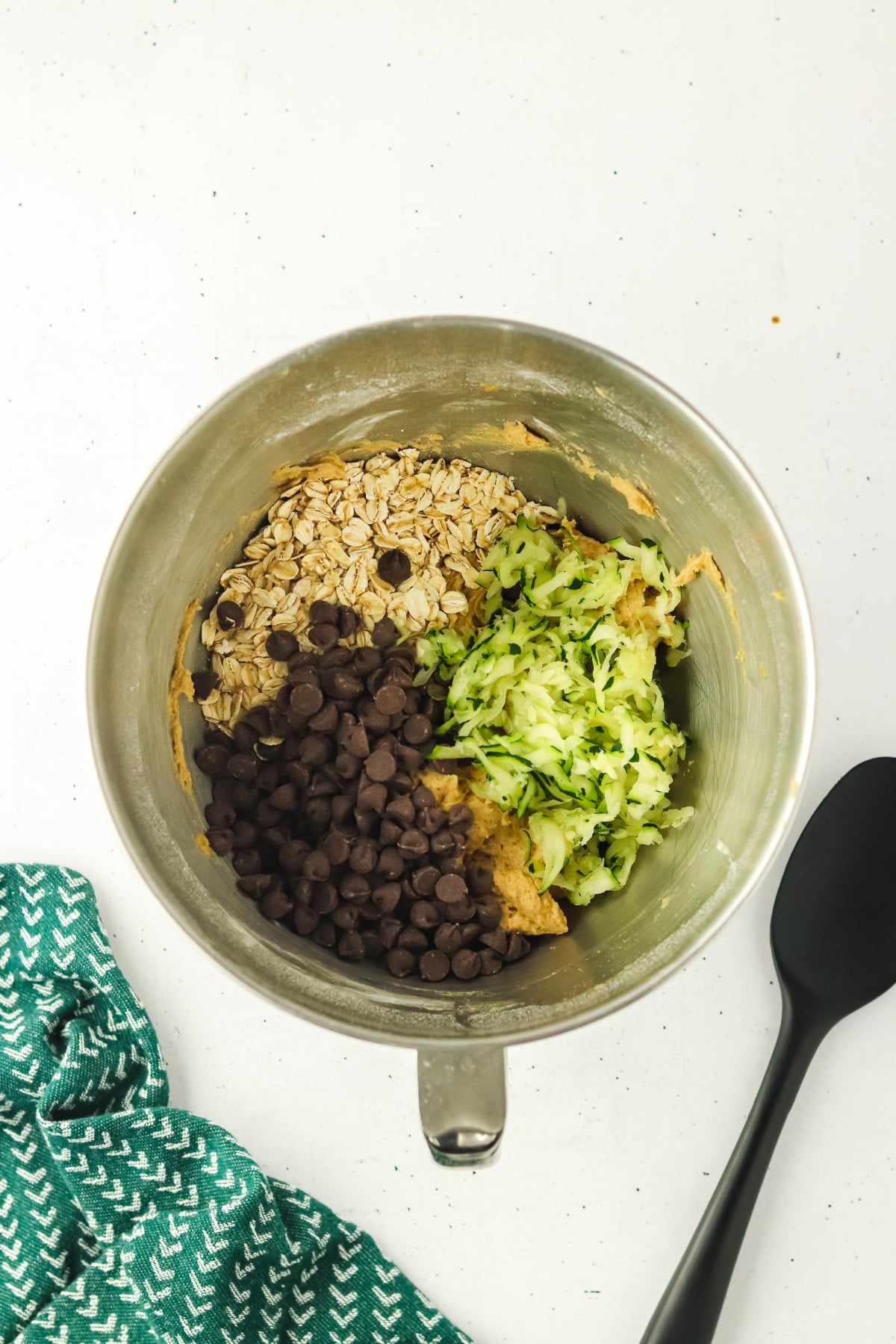 Zucchini, oats, and chocolate chips added to the mixture.