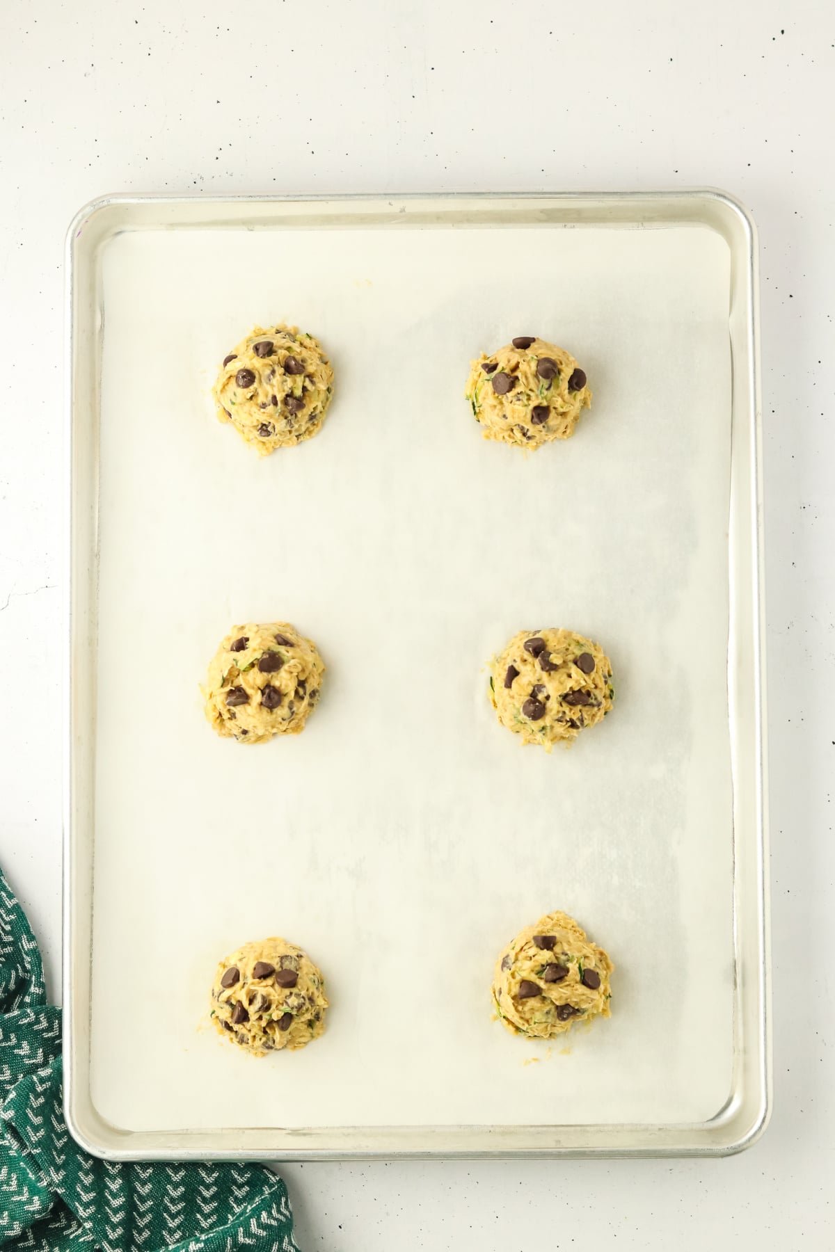 The dough scooped into the prepared baking sheet.