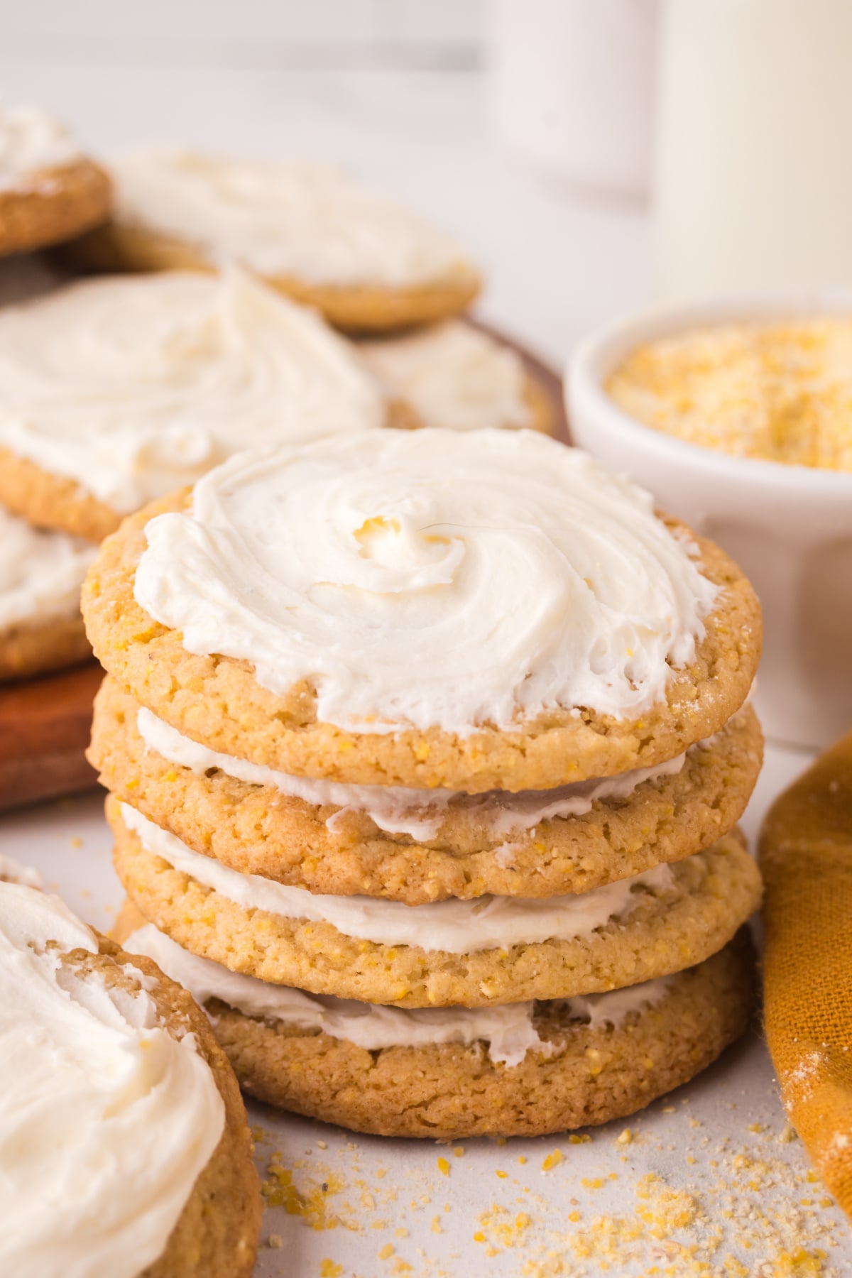A stack of cornbread cookies with icing on top.