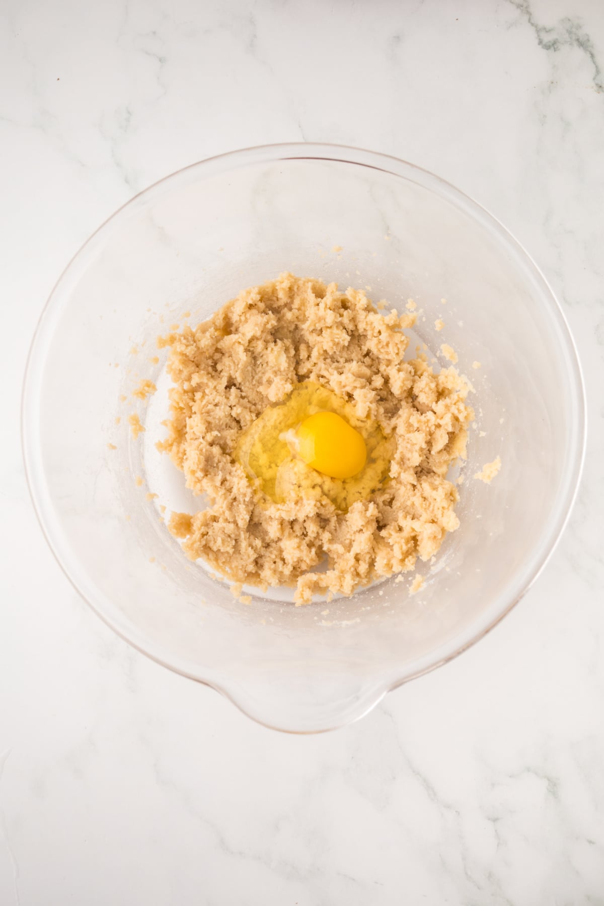 Egg added to the mixing bowl.
