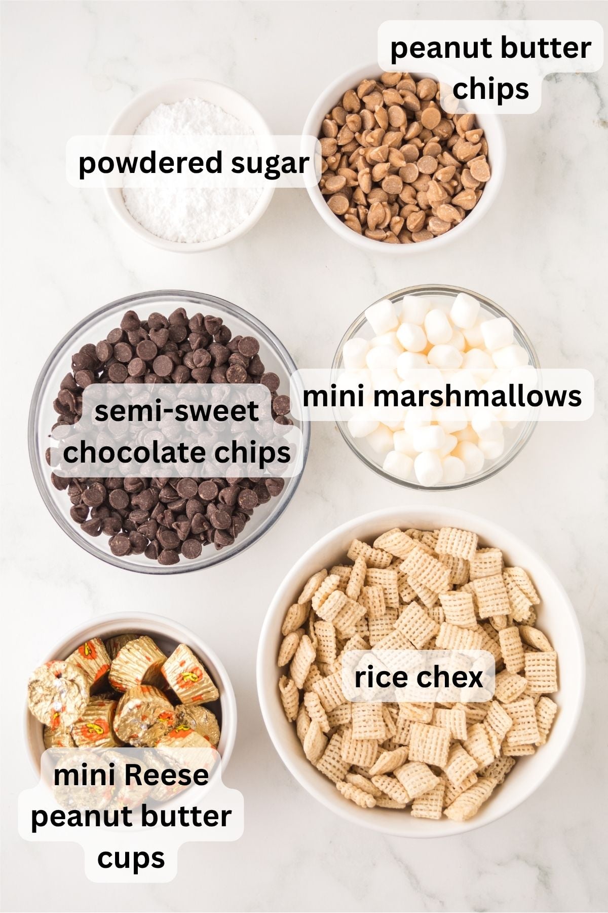 all of the ingredients needed to make Fluffernutter Muddy Buddies in bowls on a table