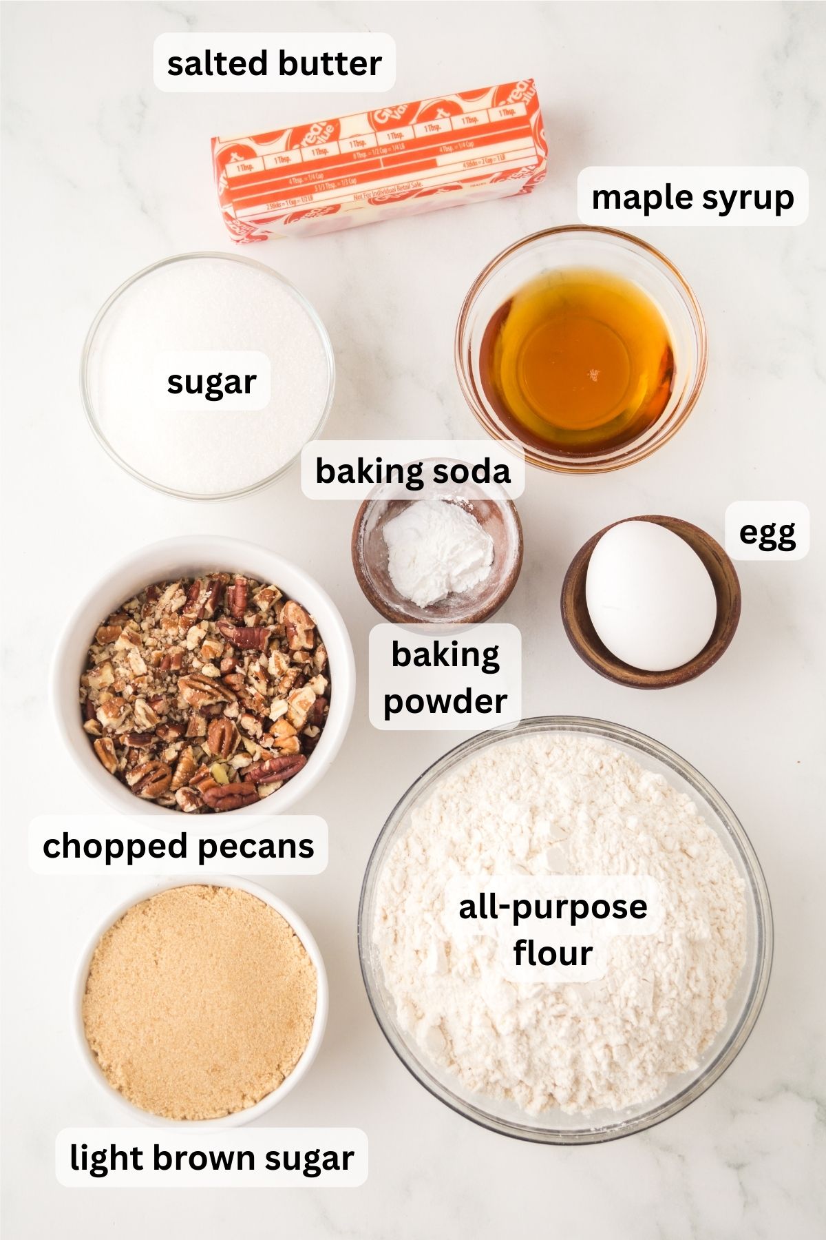 Ingredients to make these cookies in bowls on a table.
