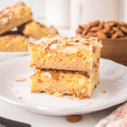 Almond croissant cookie bars on a plate.