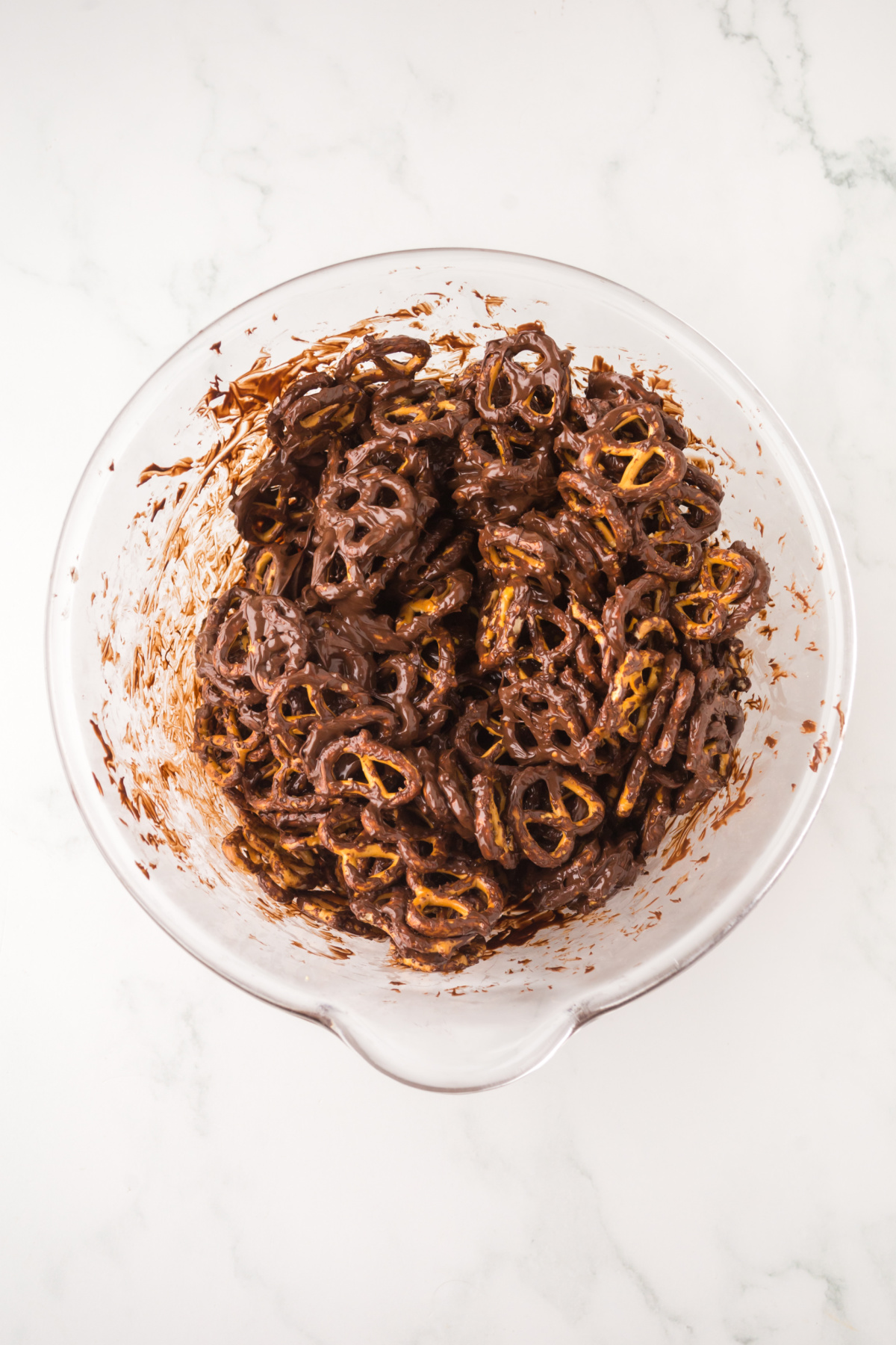 Pretzels in a bowl covered in melted chocolate.