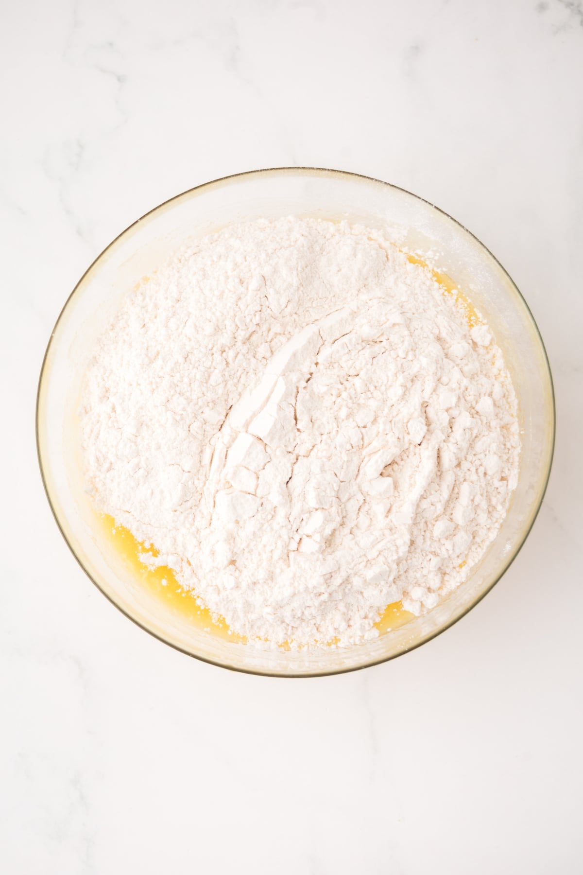 Flour folded into the mixture.