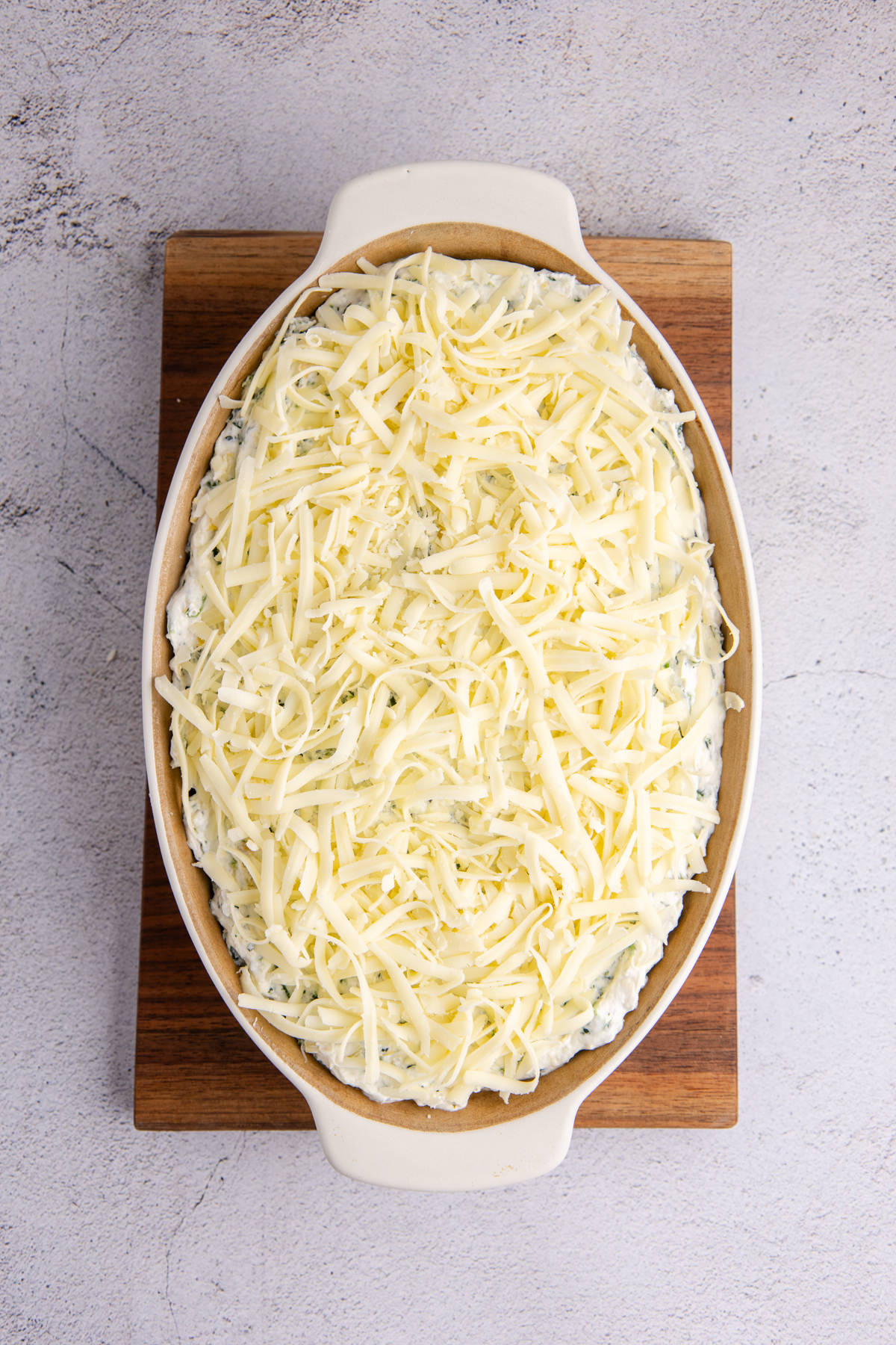 Mozzarella cheese added to the top of the mixture.