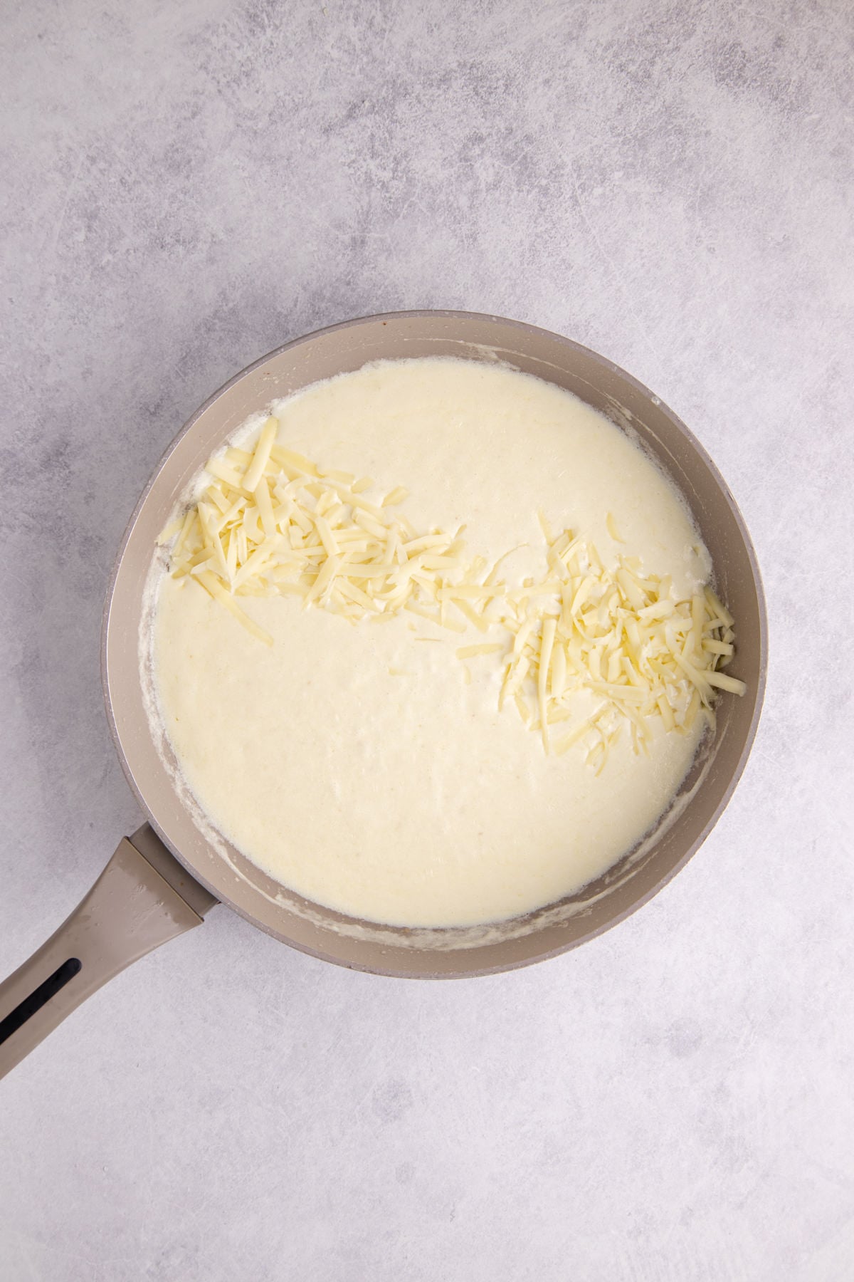 Cheese added to melt in the cream mixture.