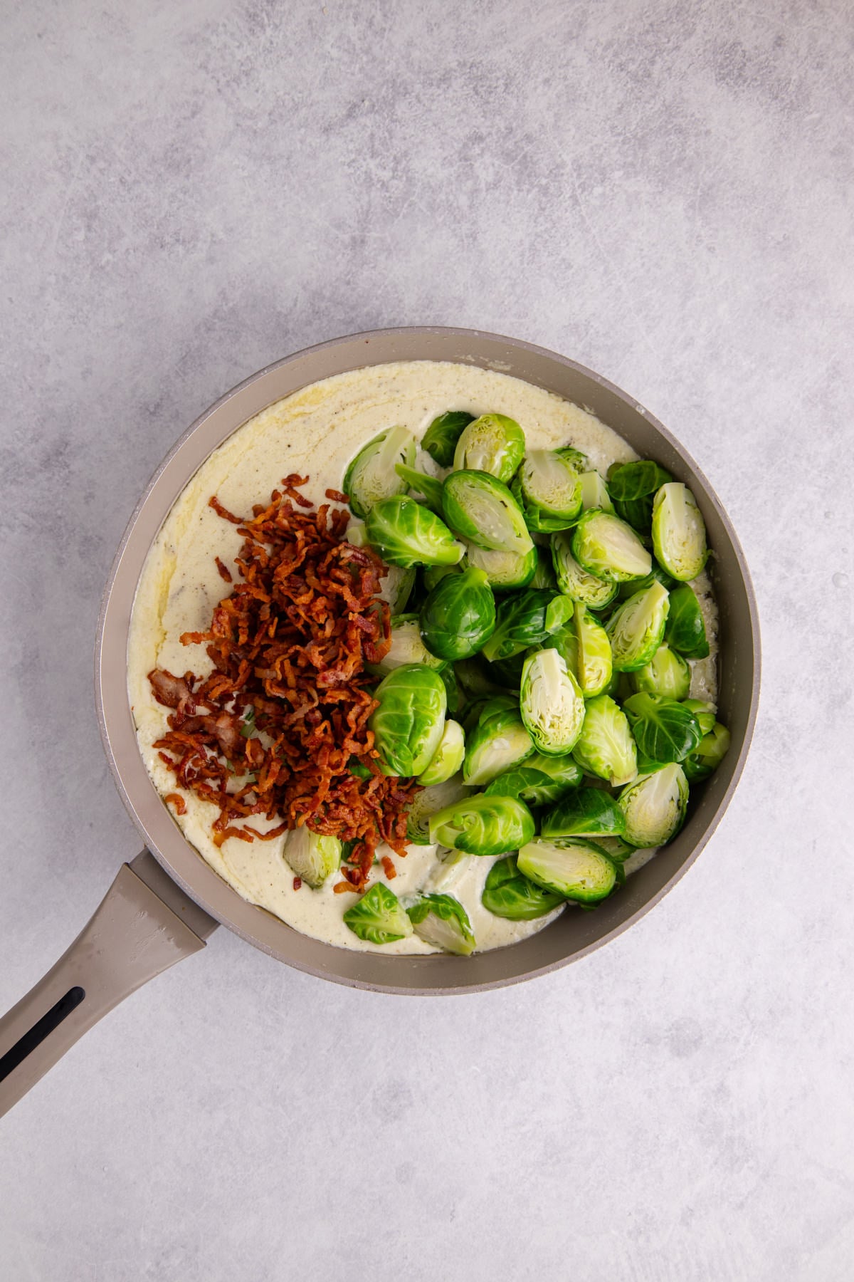 Brussels sprouts and bacon added back into the skillet.