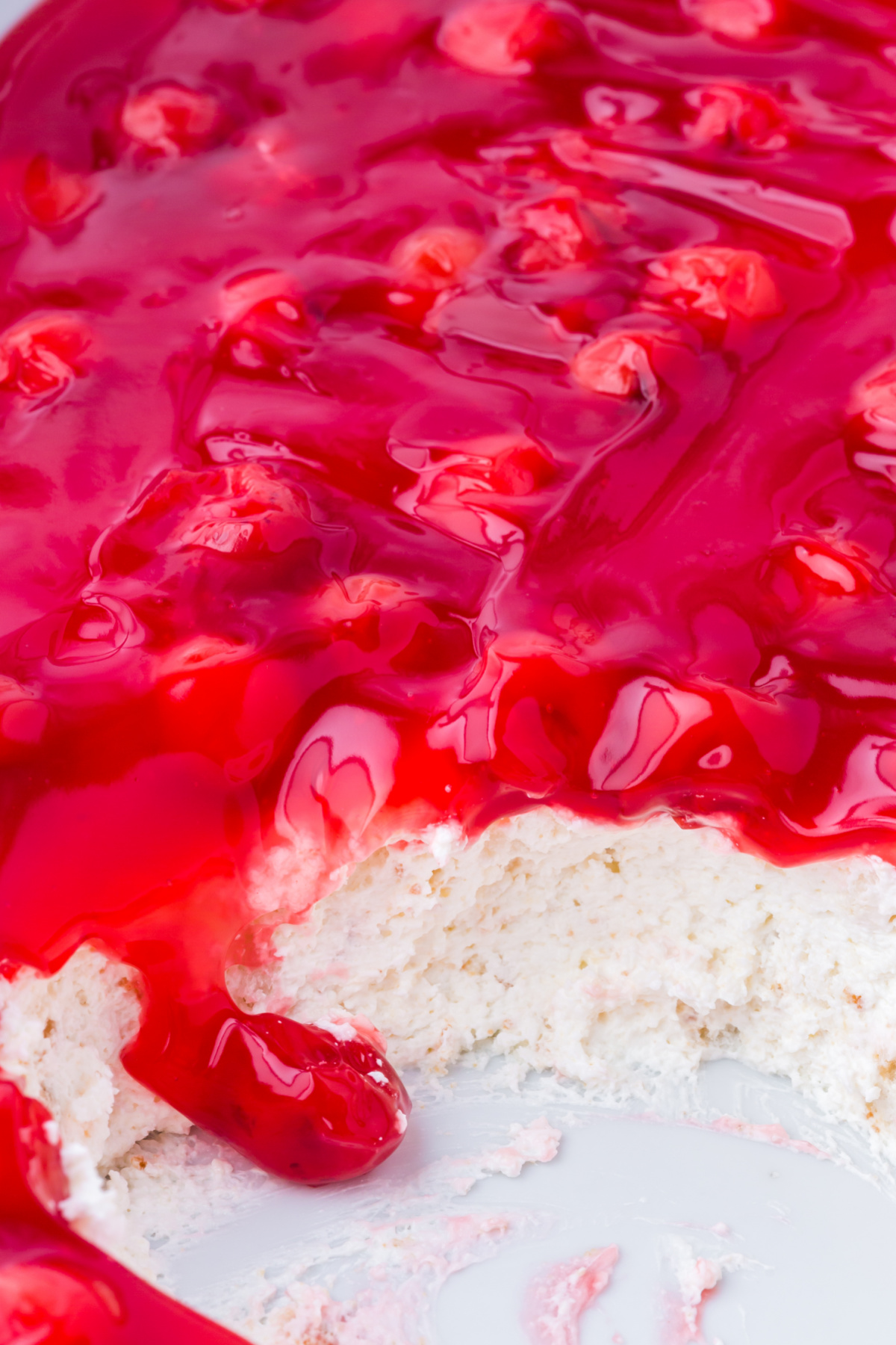 Cherry pie filling on top of a cream cheese mixture.