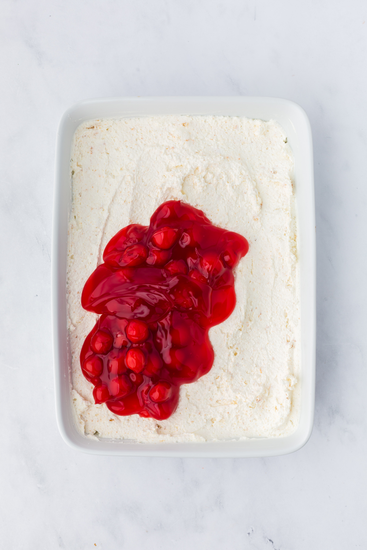 The mixture spread to the bottom of the 9x13 casserole dish.