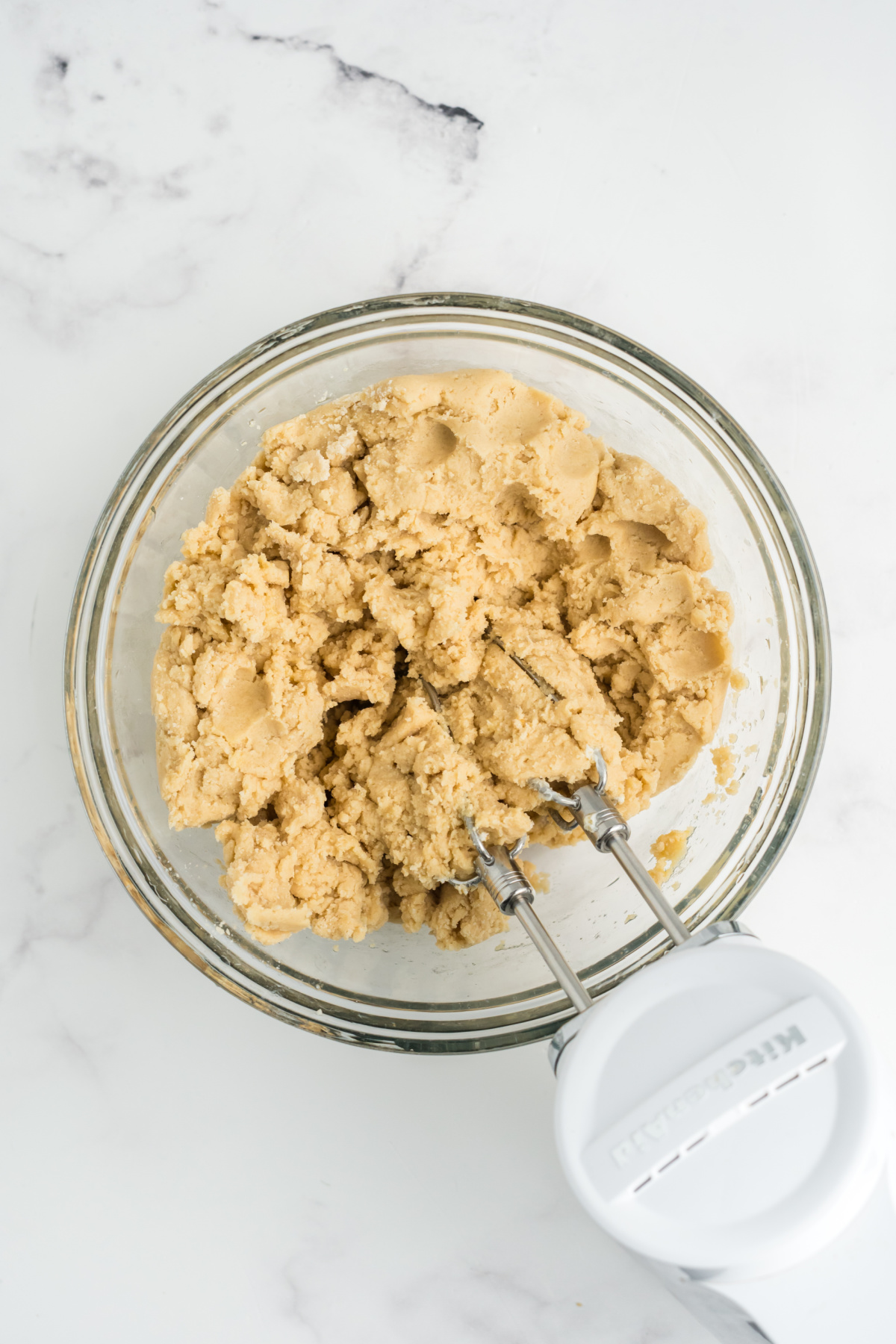 Butter and sugar beaten in a bowl.