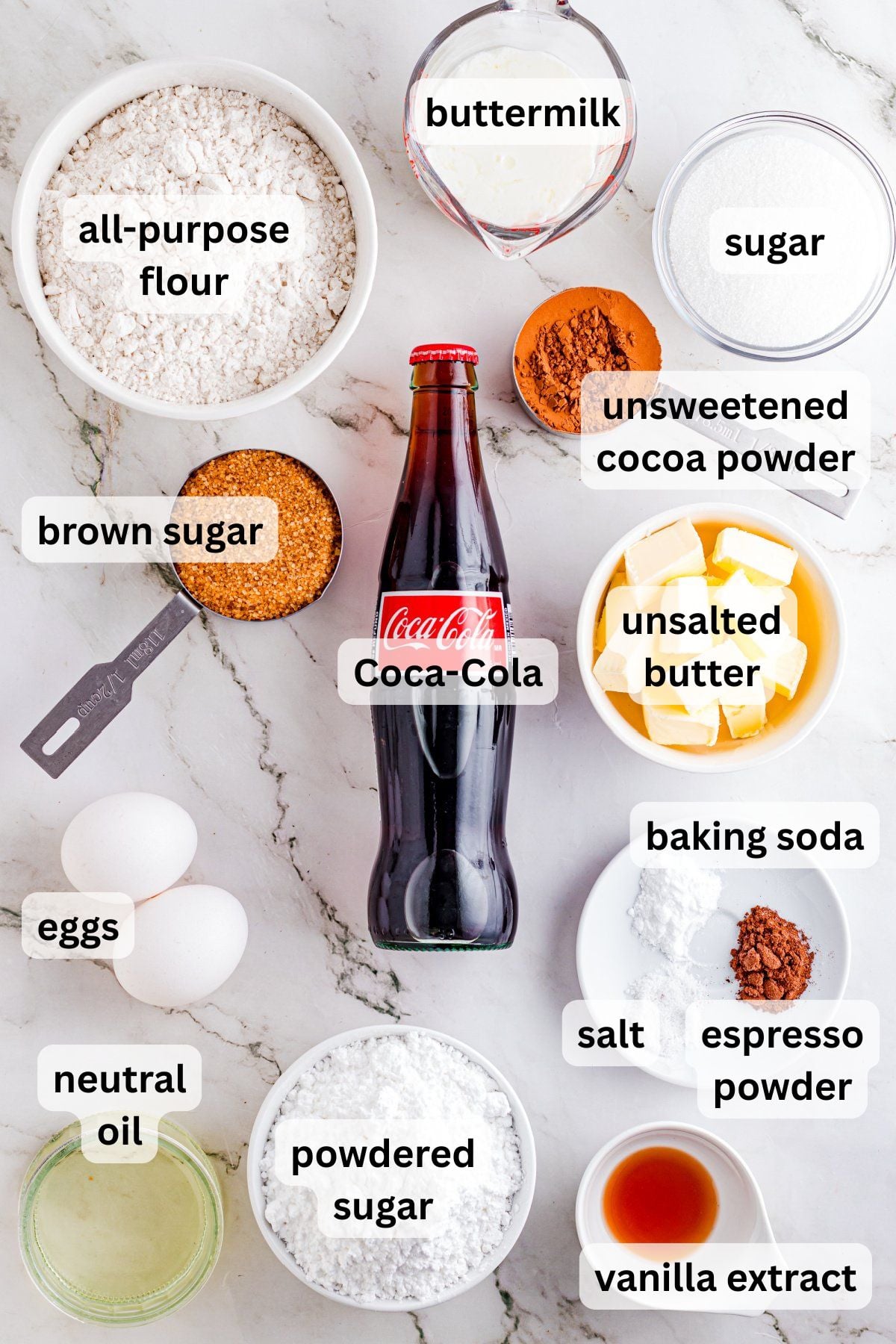 Ingredients to make this cake in bowls on a table.