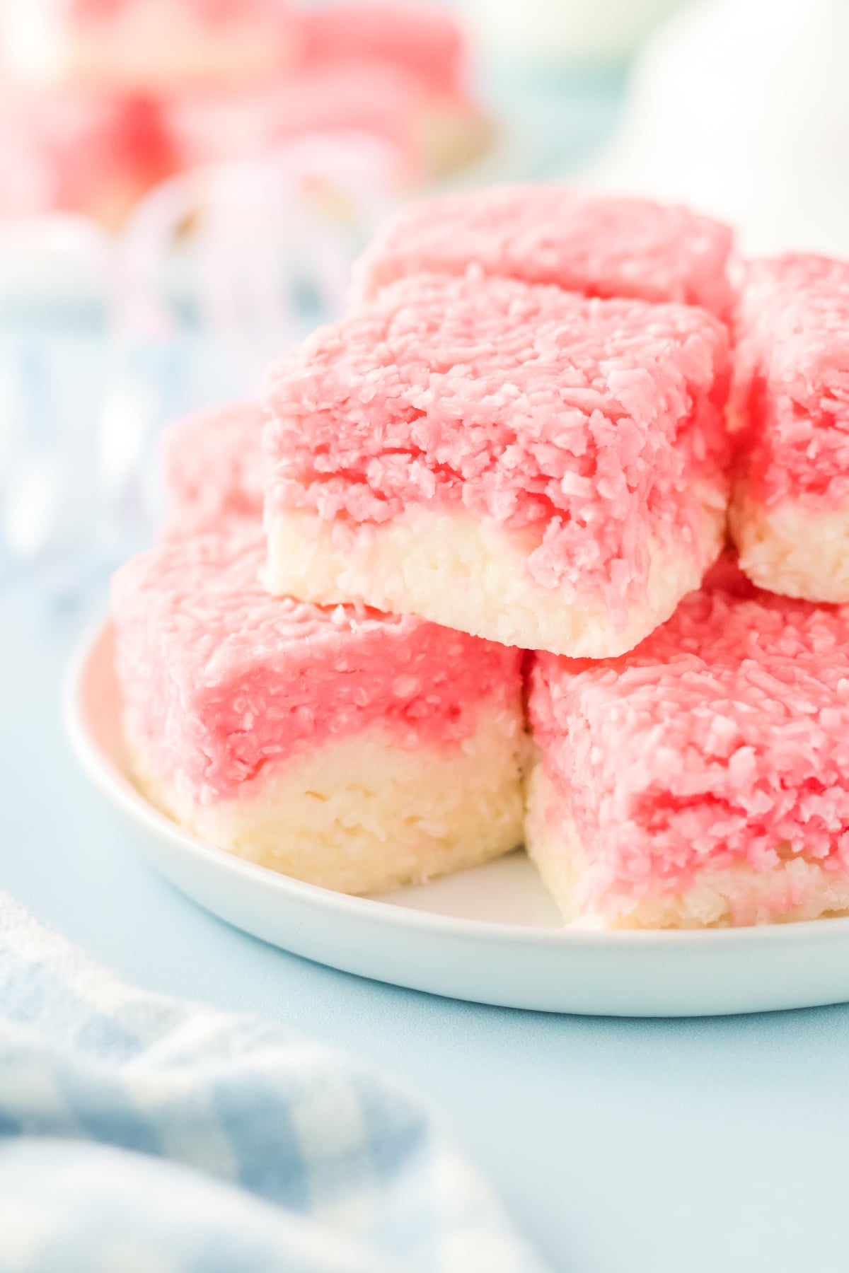 A plate filled with candy with coconut.