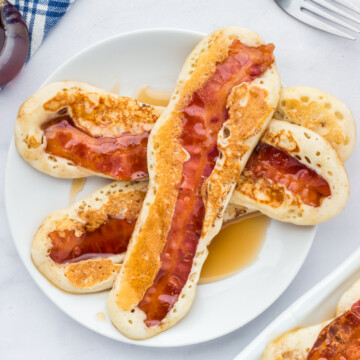 Bacon pancake dippers on a plate.