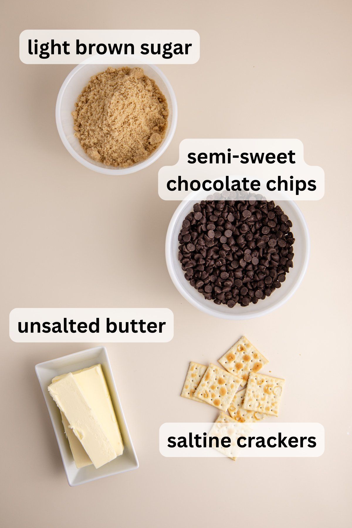 All of the ingredients needed to make Easy Christmas Crack Recipe in bowls on a table.