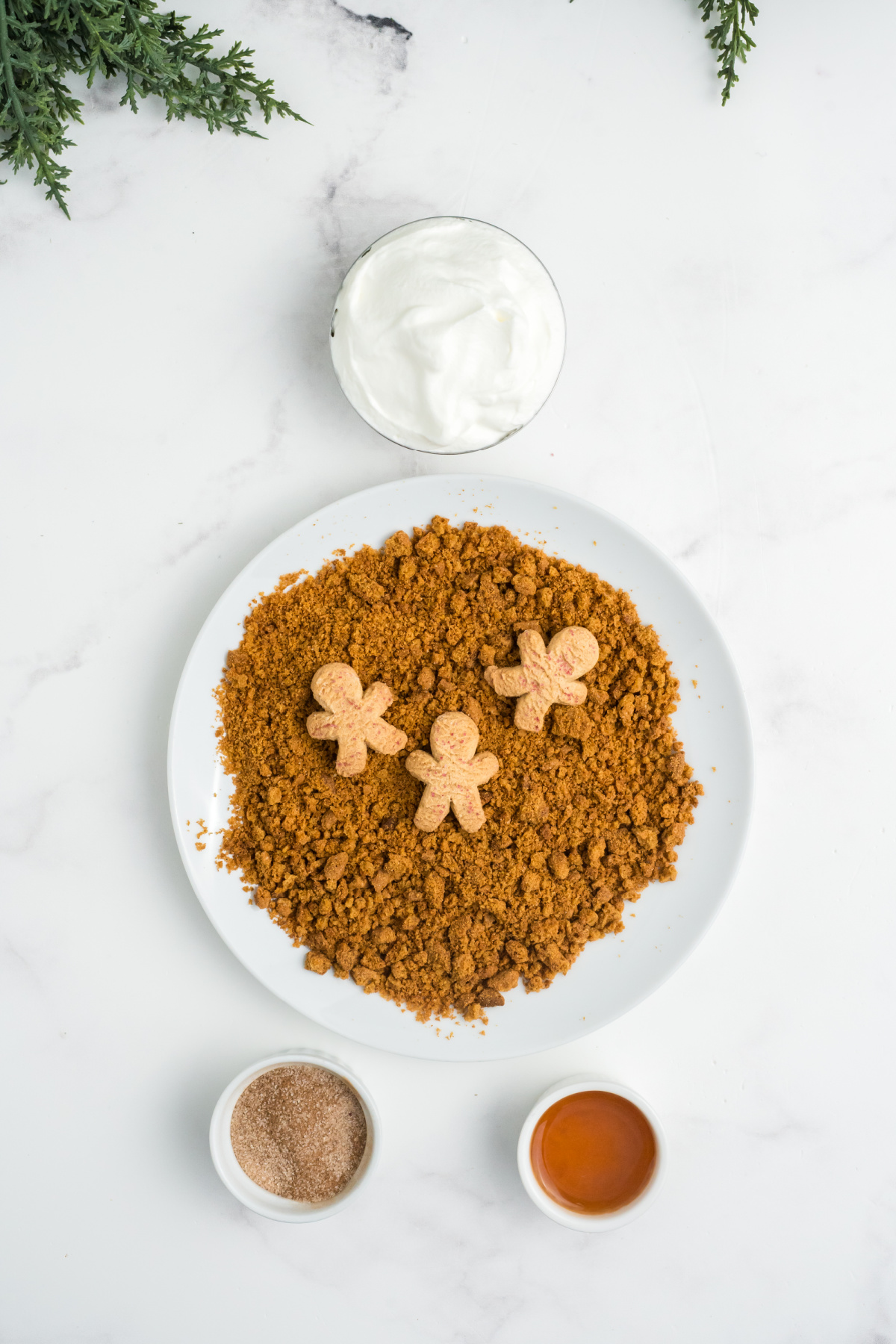 A plate with crushed gingersnap cookies.