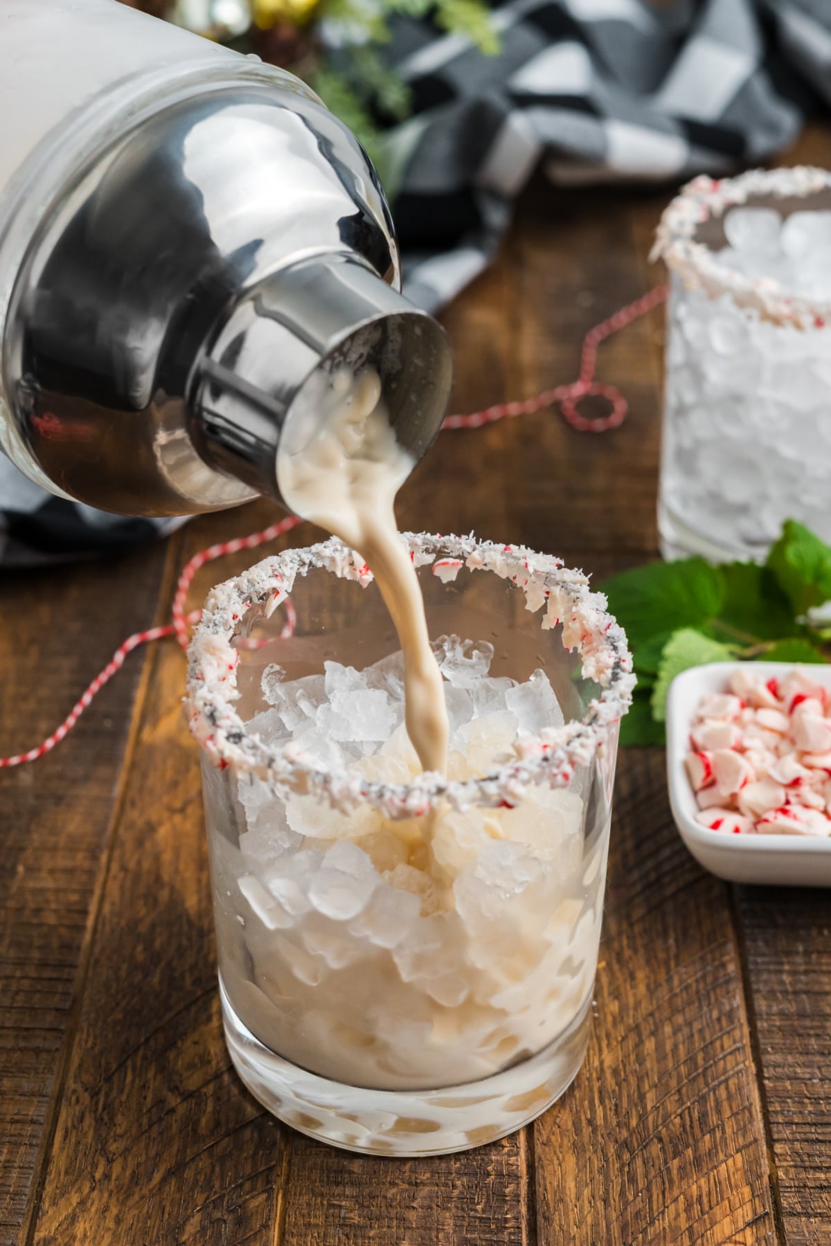 Peppermint holiday cocktail poured into a glass.