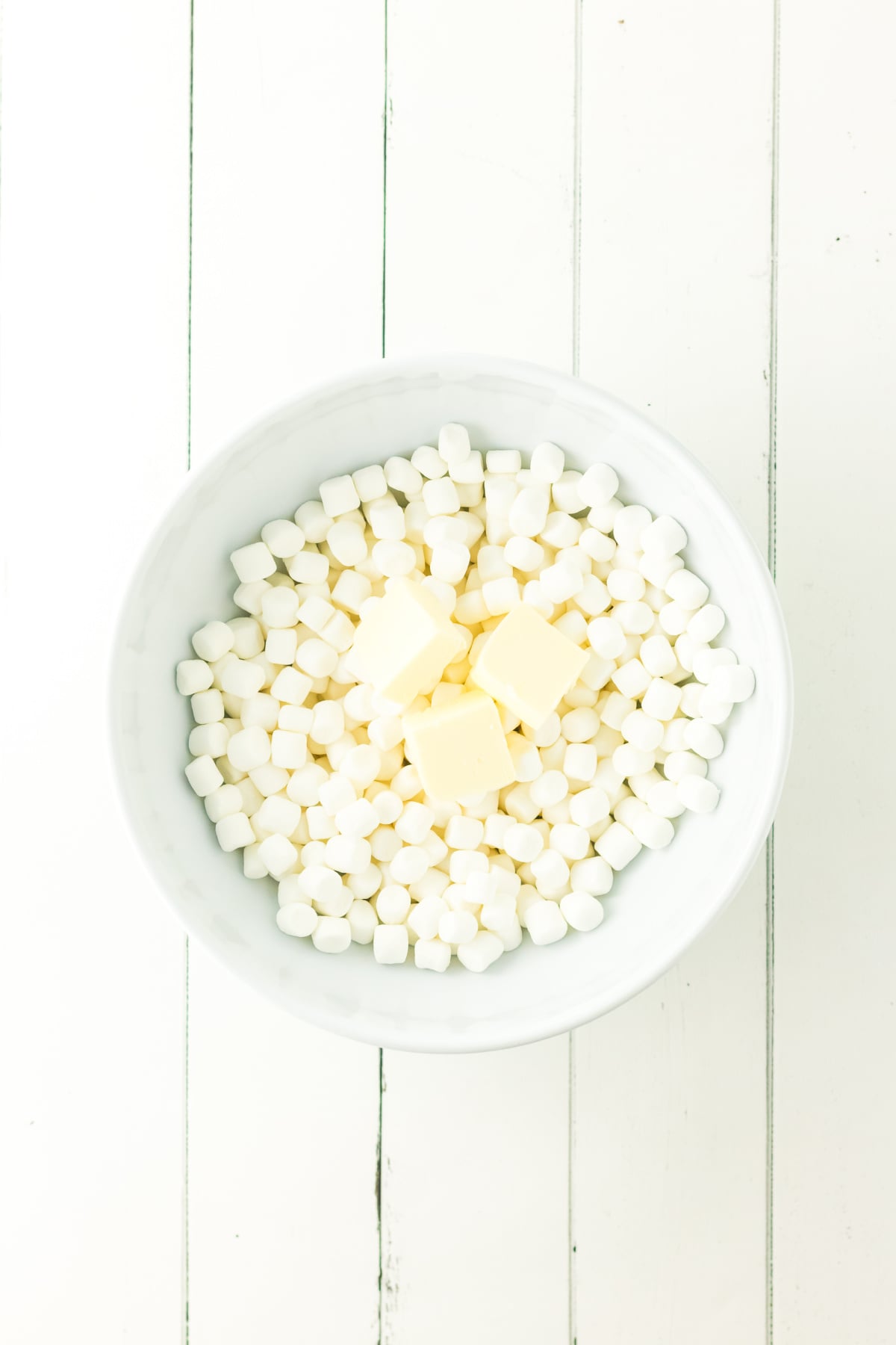 Melted butter and marshmallows in a bowl.