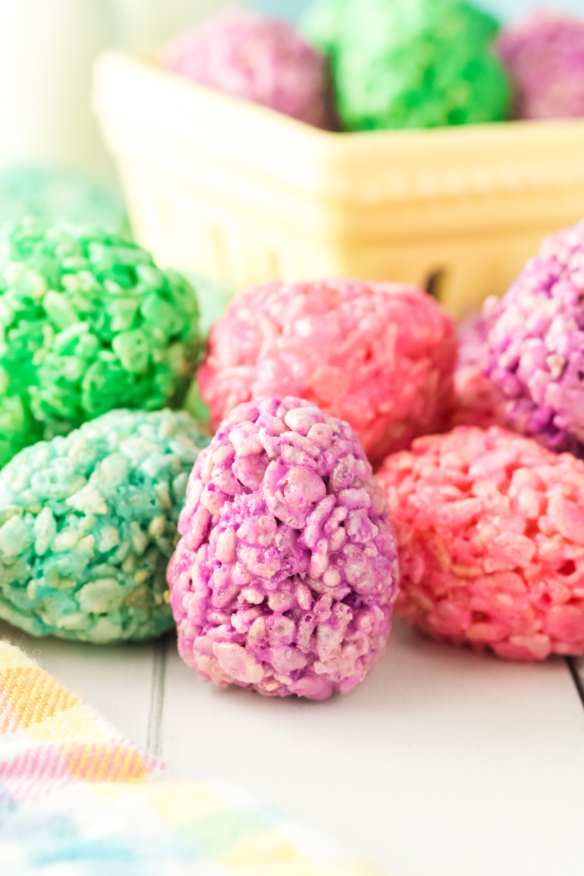 Easter eggs shaped rice krispie treats on a table.