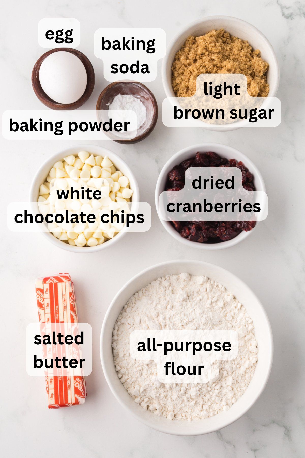Ingredients to make these cookies in bowls on a table.