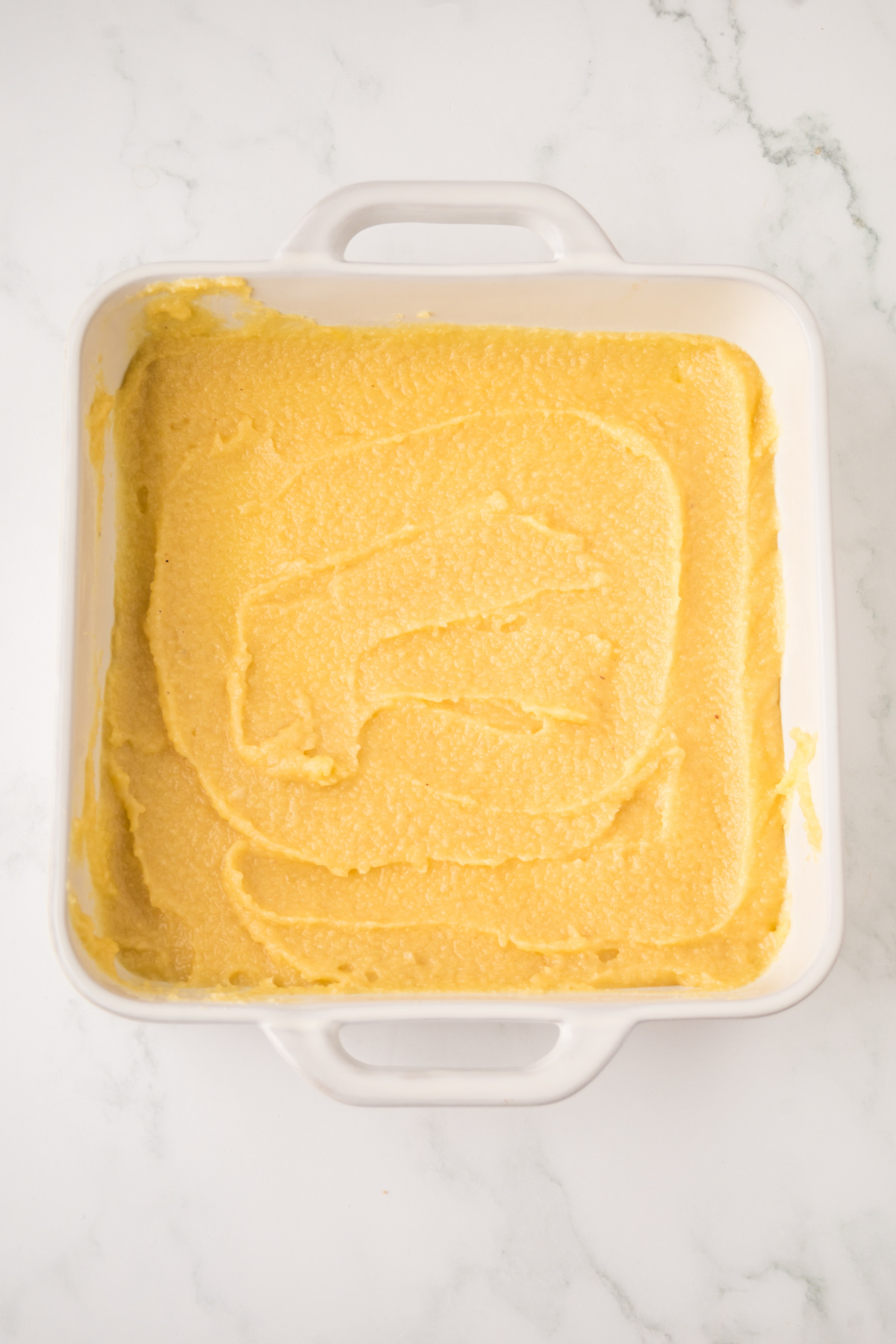 Spread the frangipane evenly on top of the cookie layer.